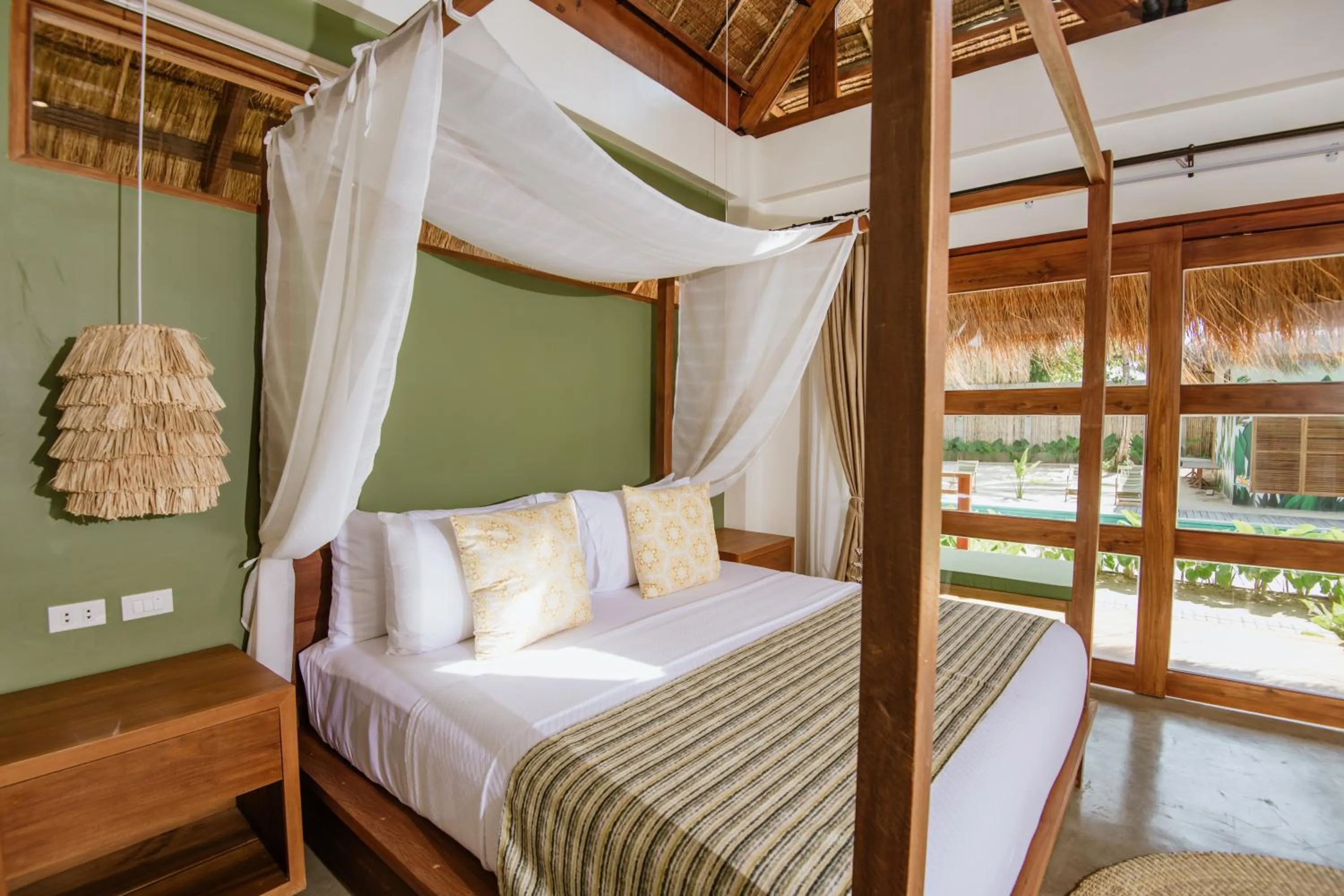 Bed in Las Palmas Villas and Casitas Siargao