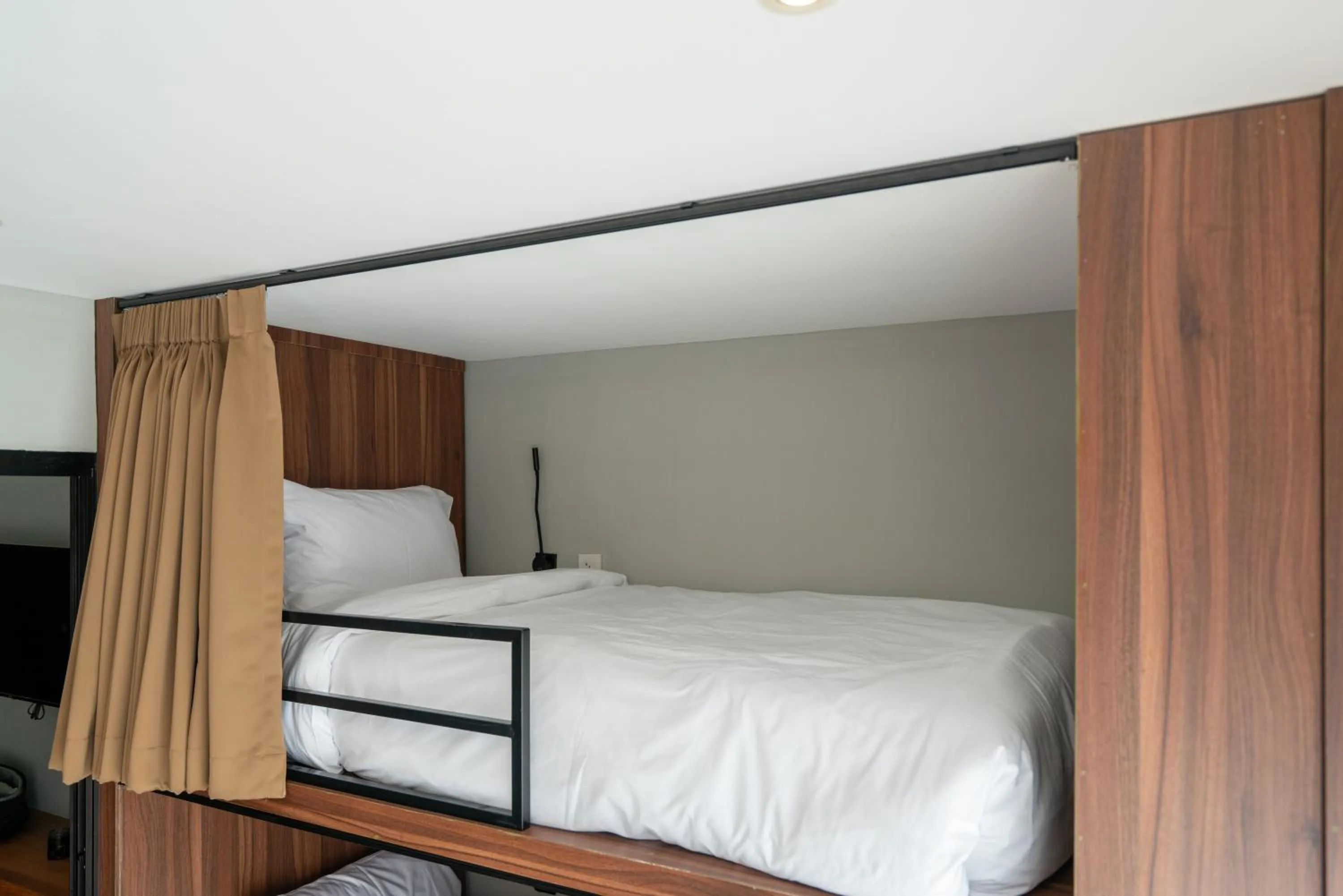 Bed in Woodstory Boutique Hotel