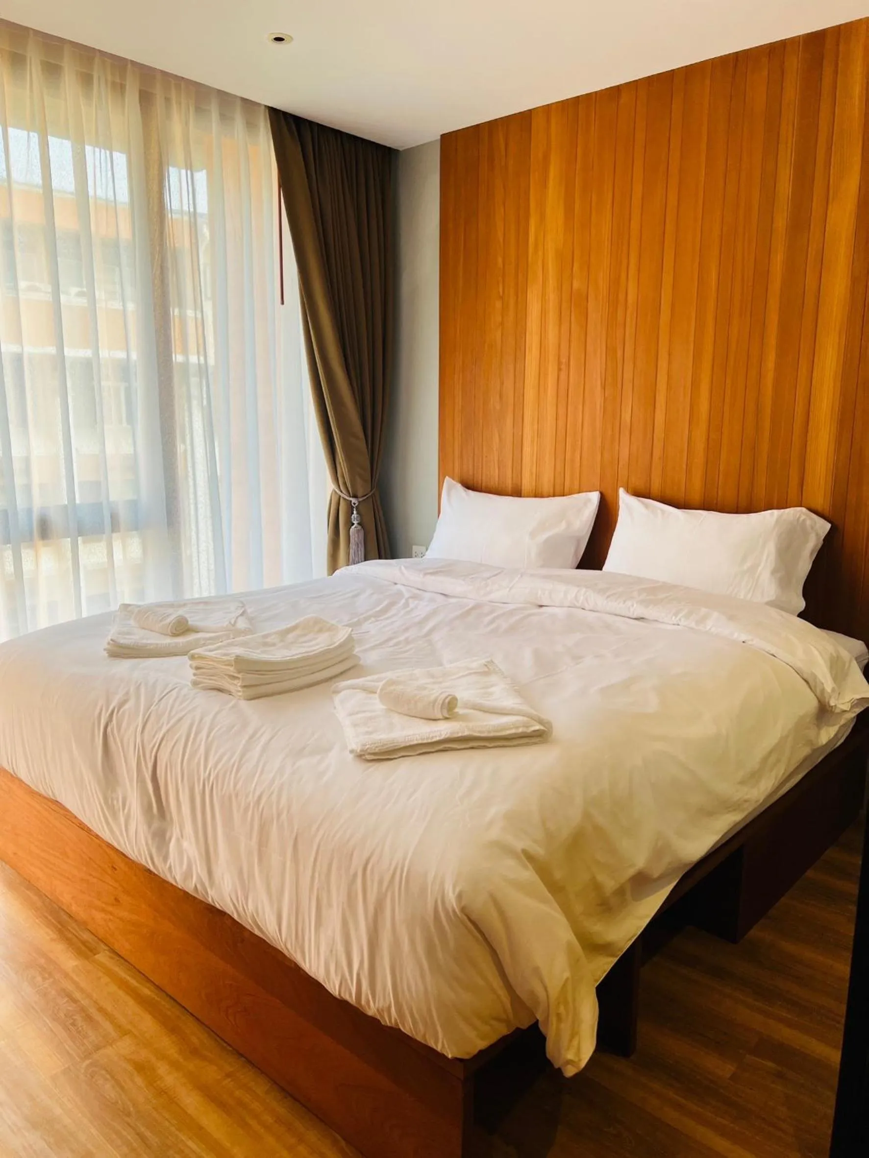 Bed in Woodstory Boutique Hotel