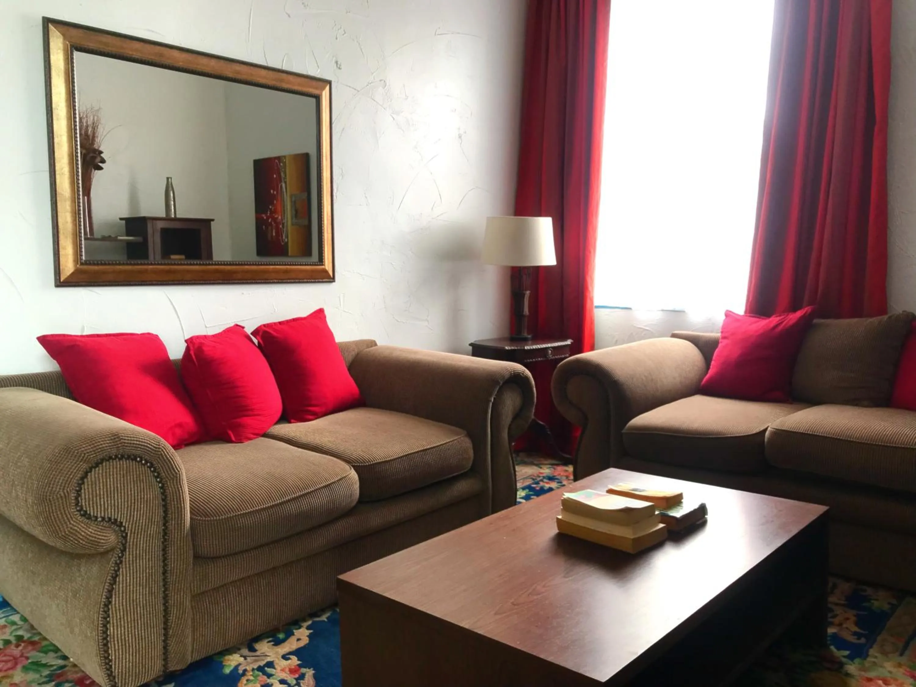 Communal lounge/ TV room in Athenian Villa