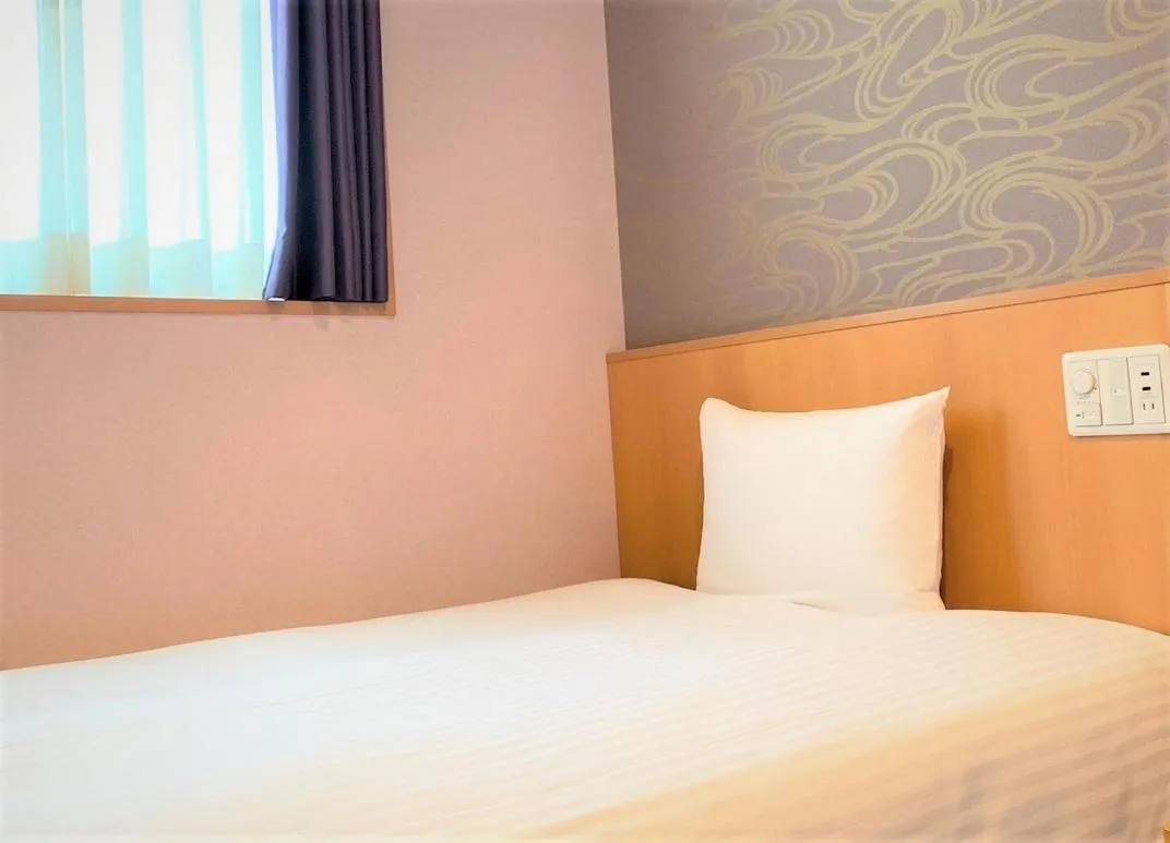 Bed in SAKURA SKY HOTEL KASHIWA(桜スカイホテル柏)