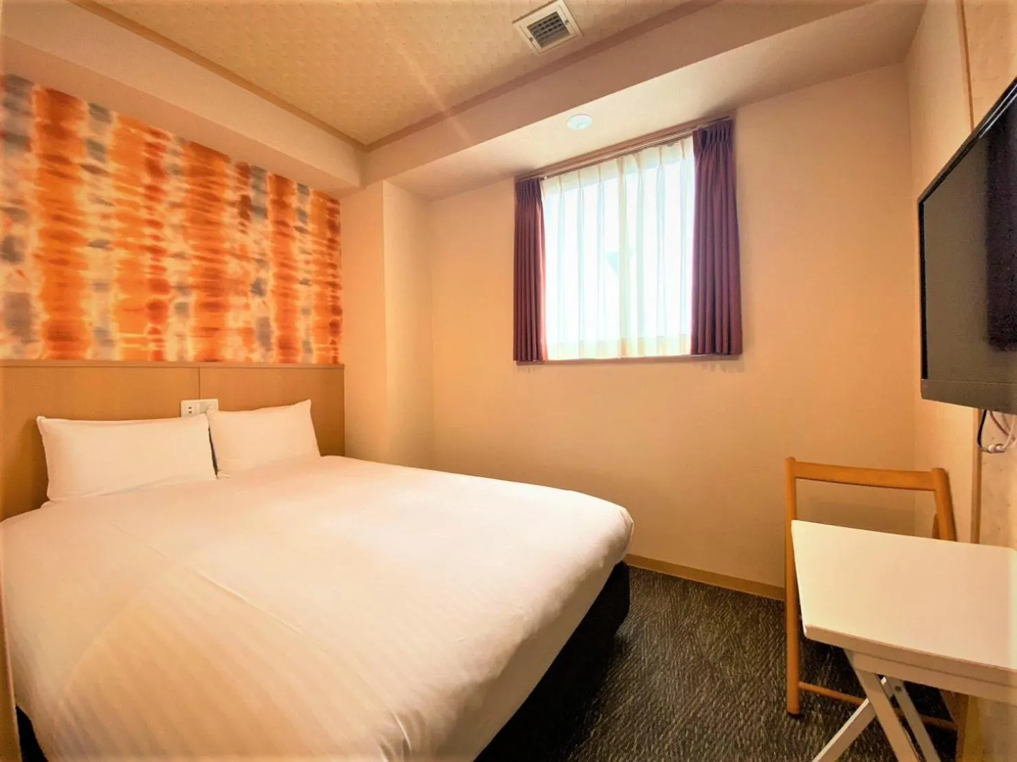 Bed in SAKURA SKY HOTEL KASHIWA(桜スカイホテル柏)