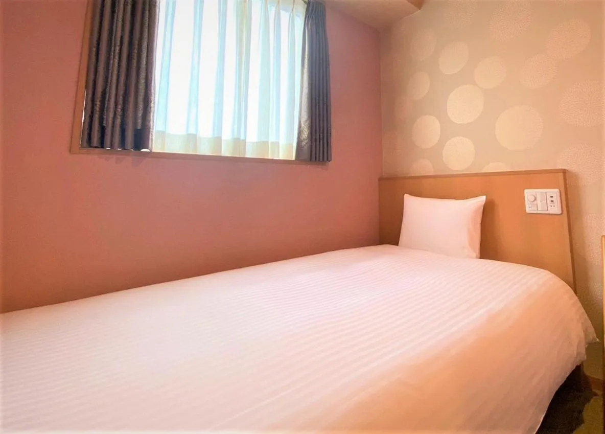 Bed in SAKURA SKY HOTEL KASHIWA(桜スカイホテル柏)