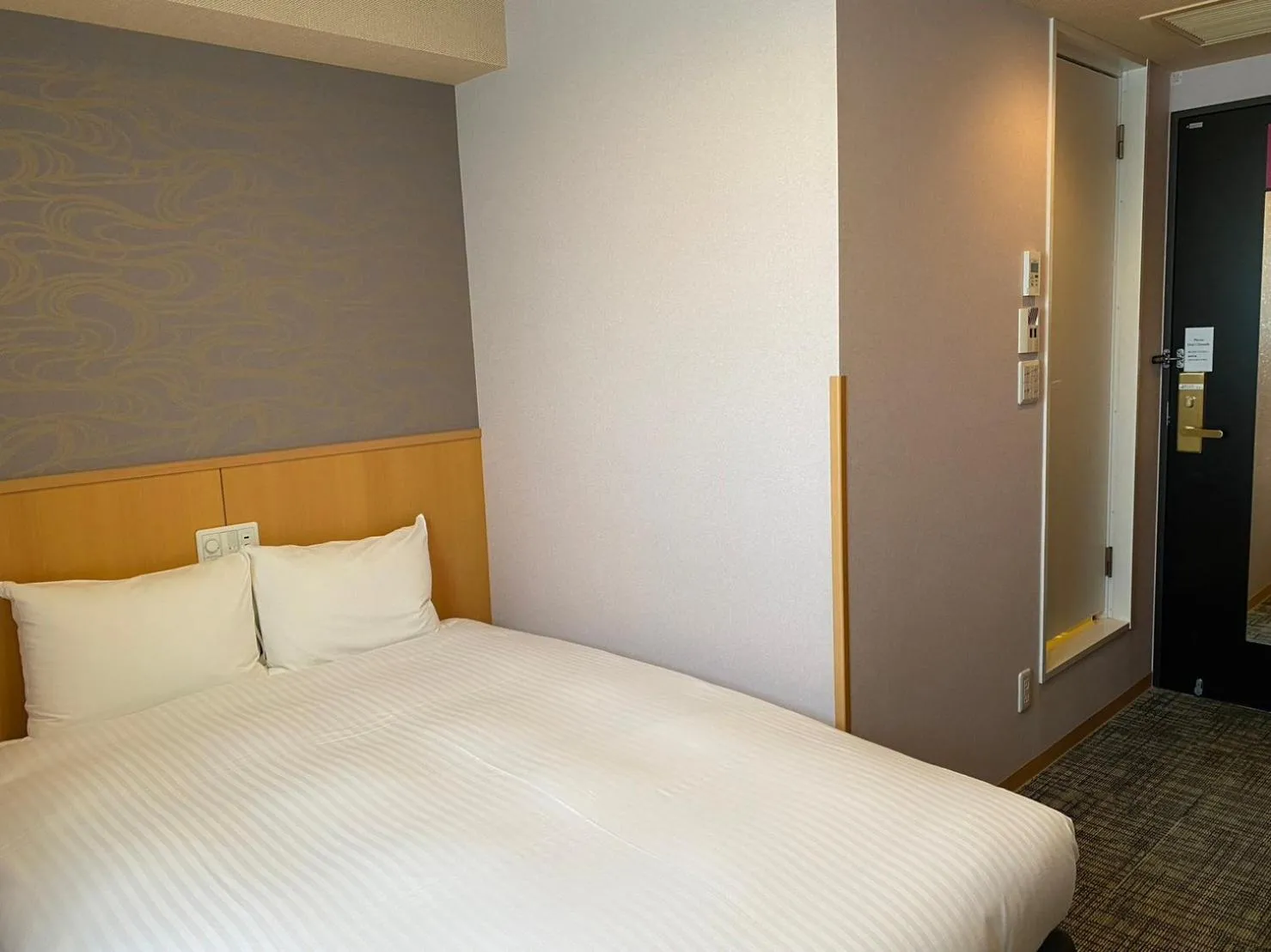 Bed in SAKURA SKY HOTEL KASHIWA(桜スカイホテル柏)
