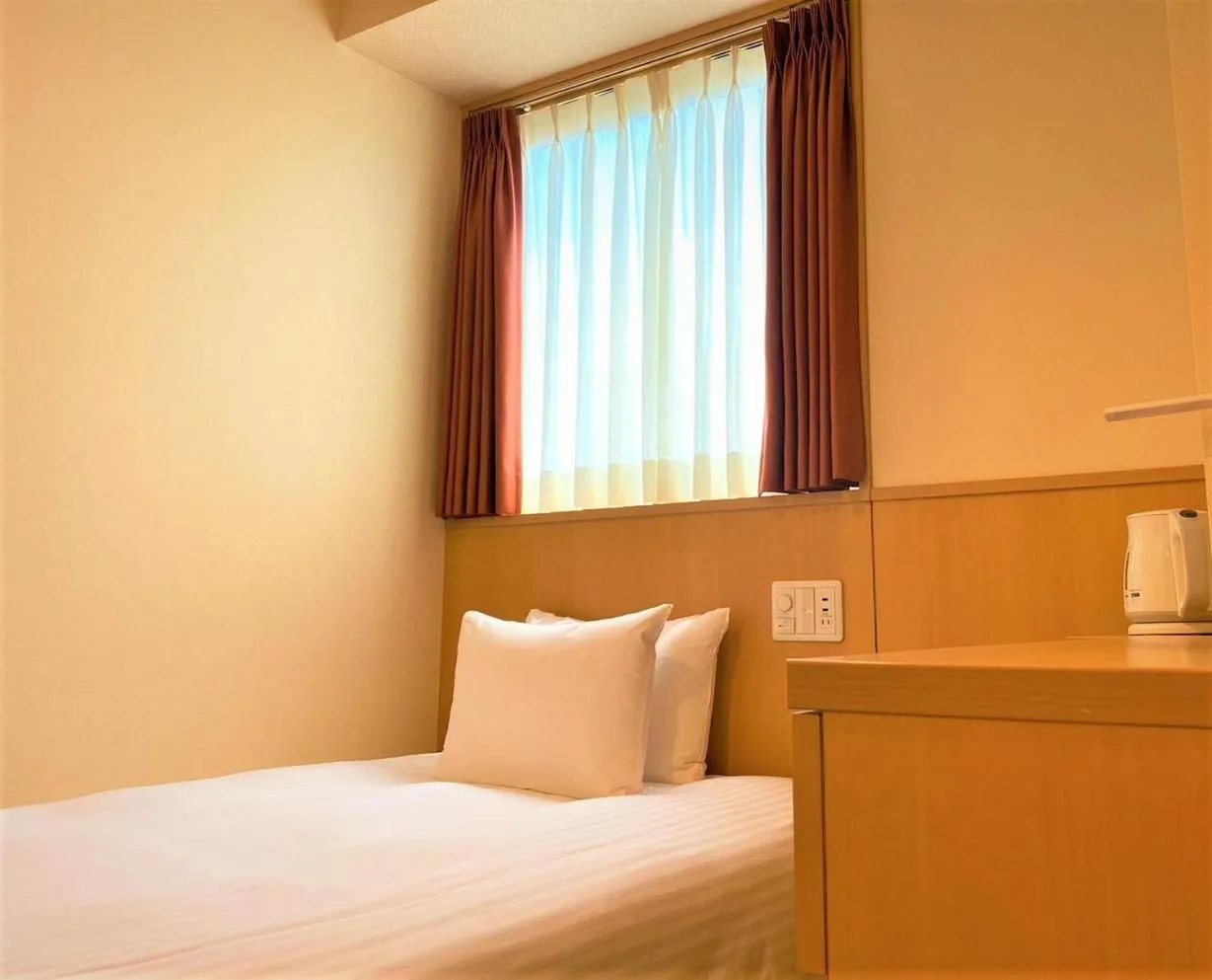 Bed in SAKURA SKY HOTEL KASHIWA(桜スカイホテル柏)