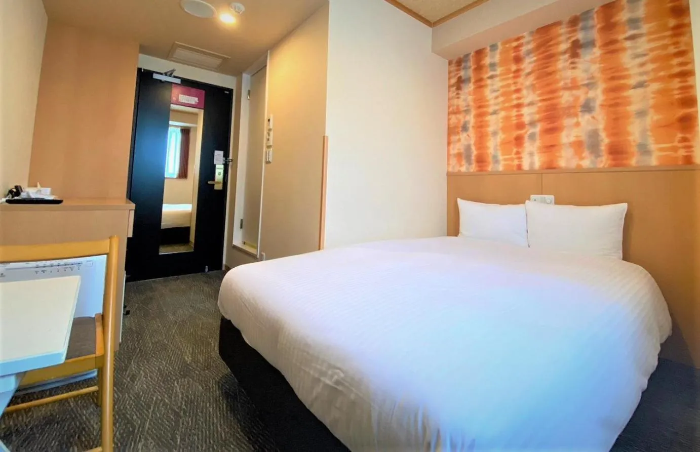 Bed in SAKURA SKY HOTEL KASHIWA(桜スカイホテル柏)