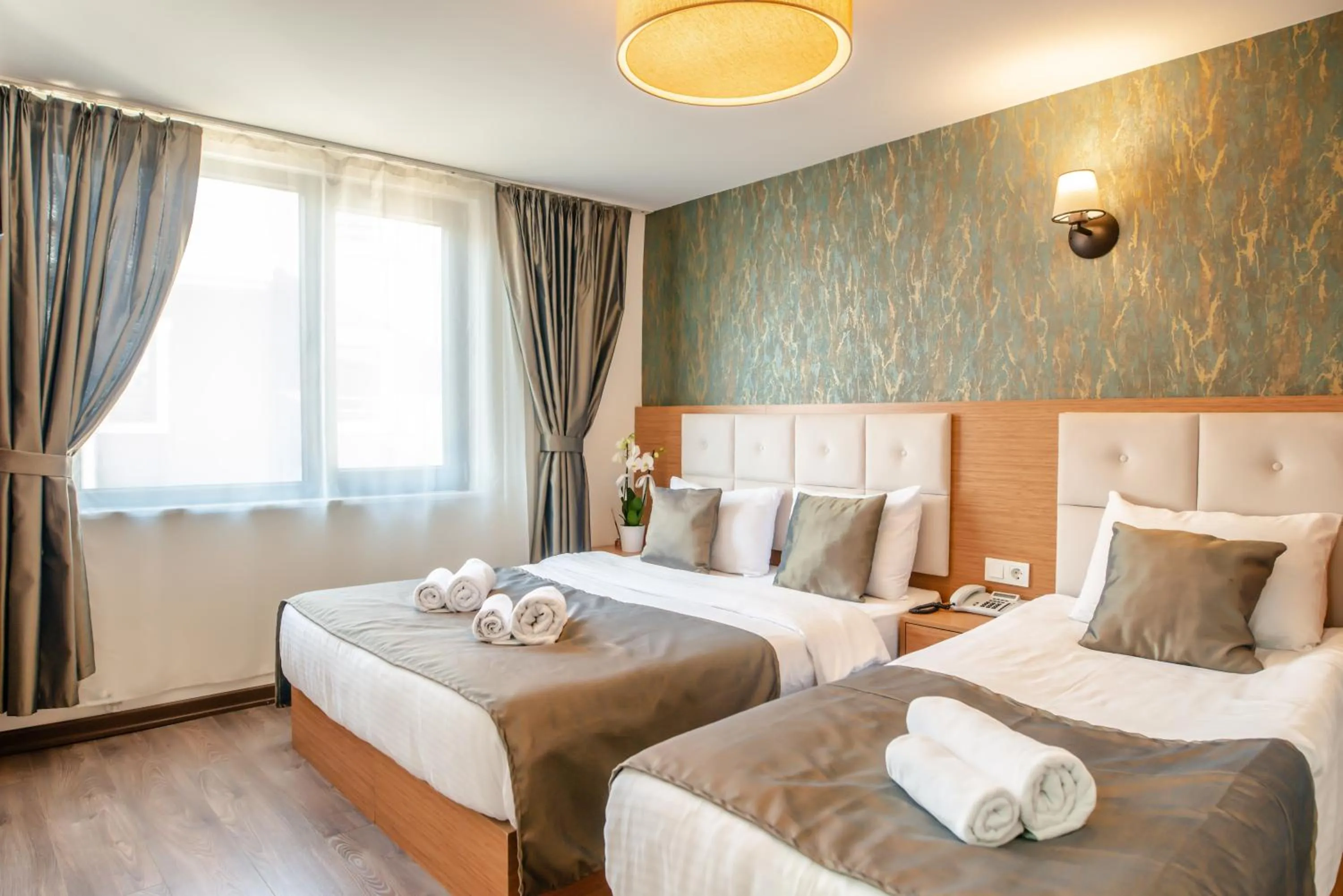 Bed in The Camelot Hotel