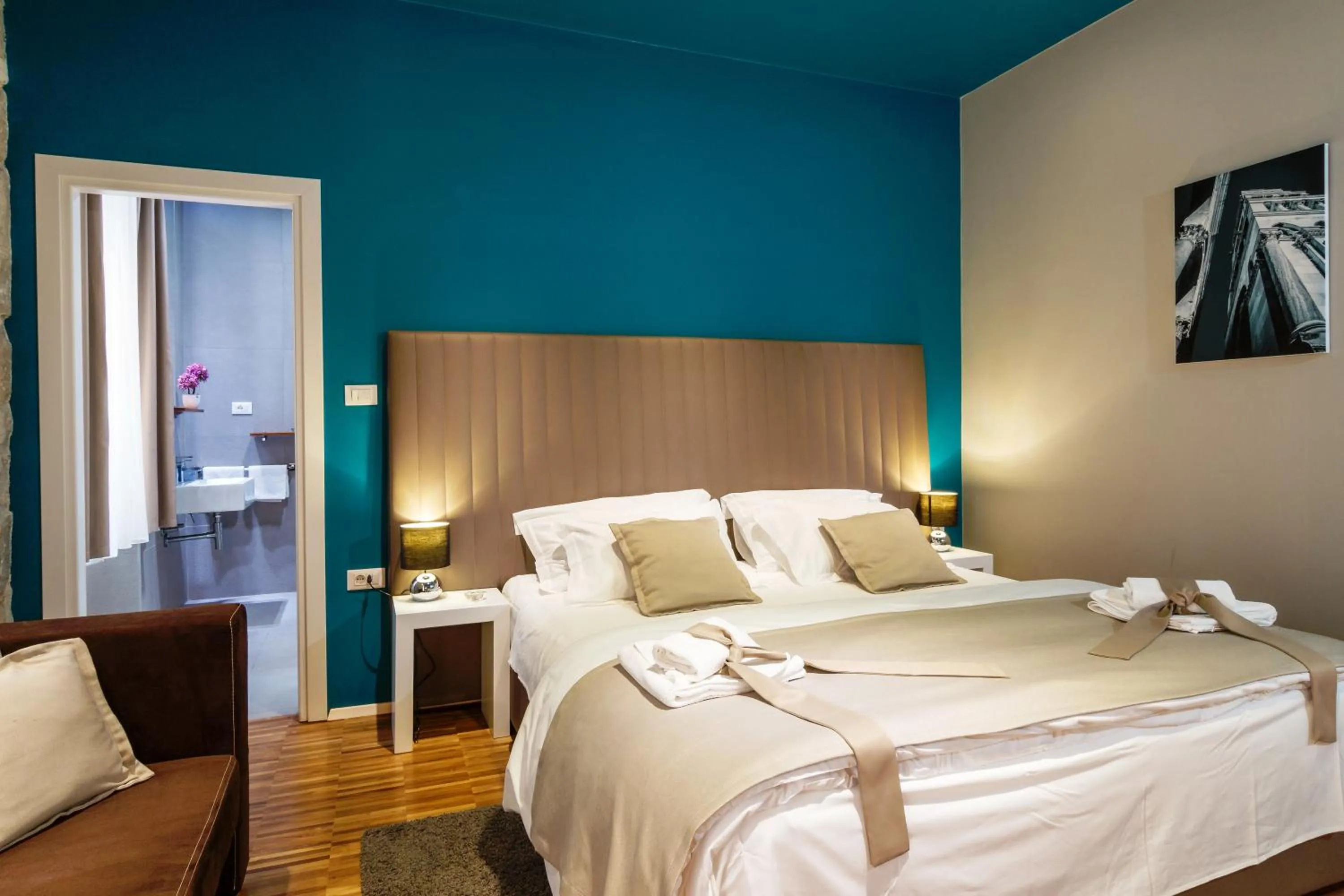 Bed in Riva Luxury Rooms