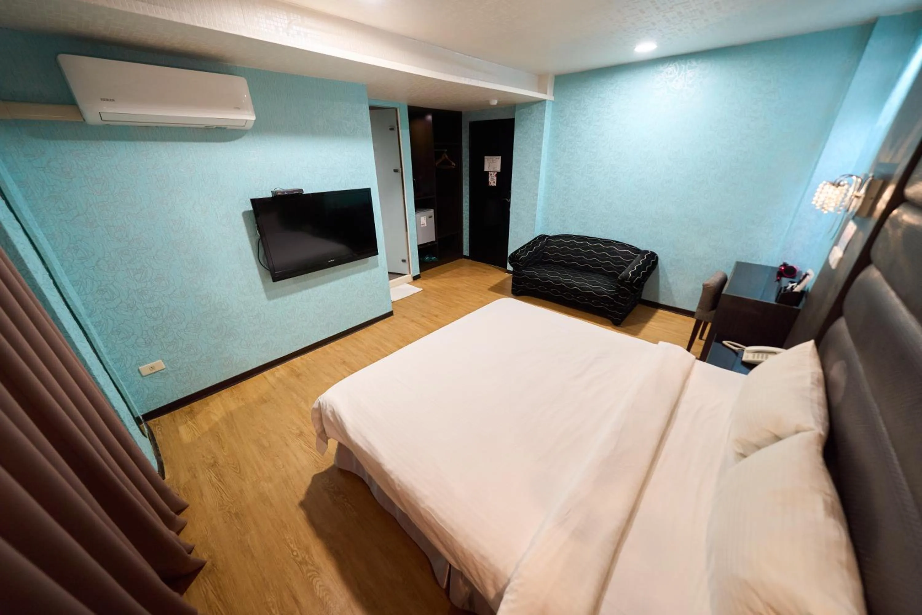 Bed in The Riverside Hotel Fashion