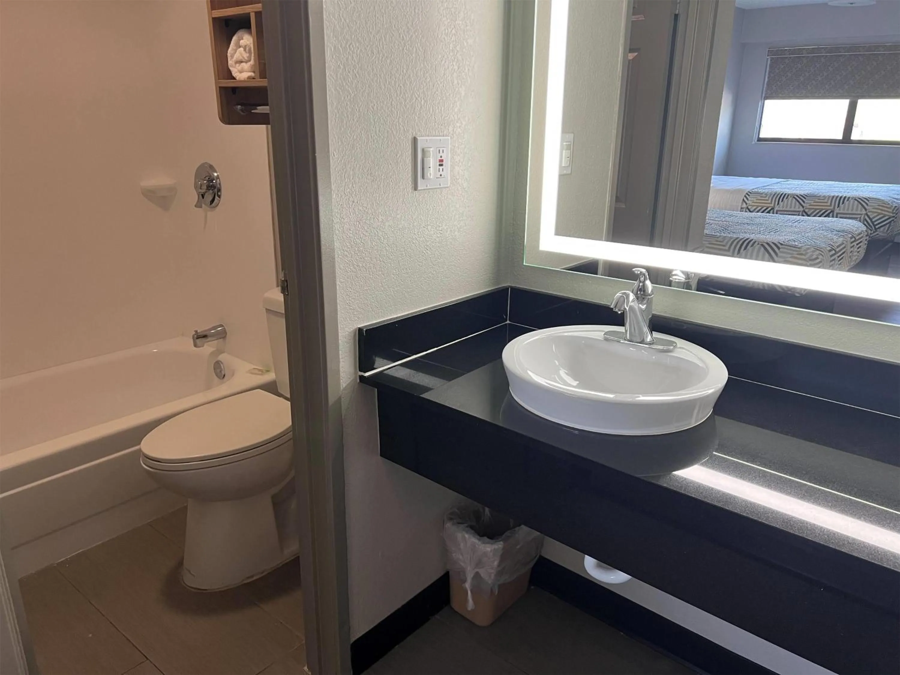 Bathroom in Days Inn by Wyndham Kansas City Northeast