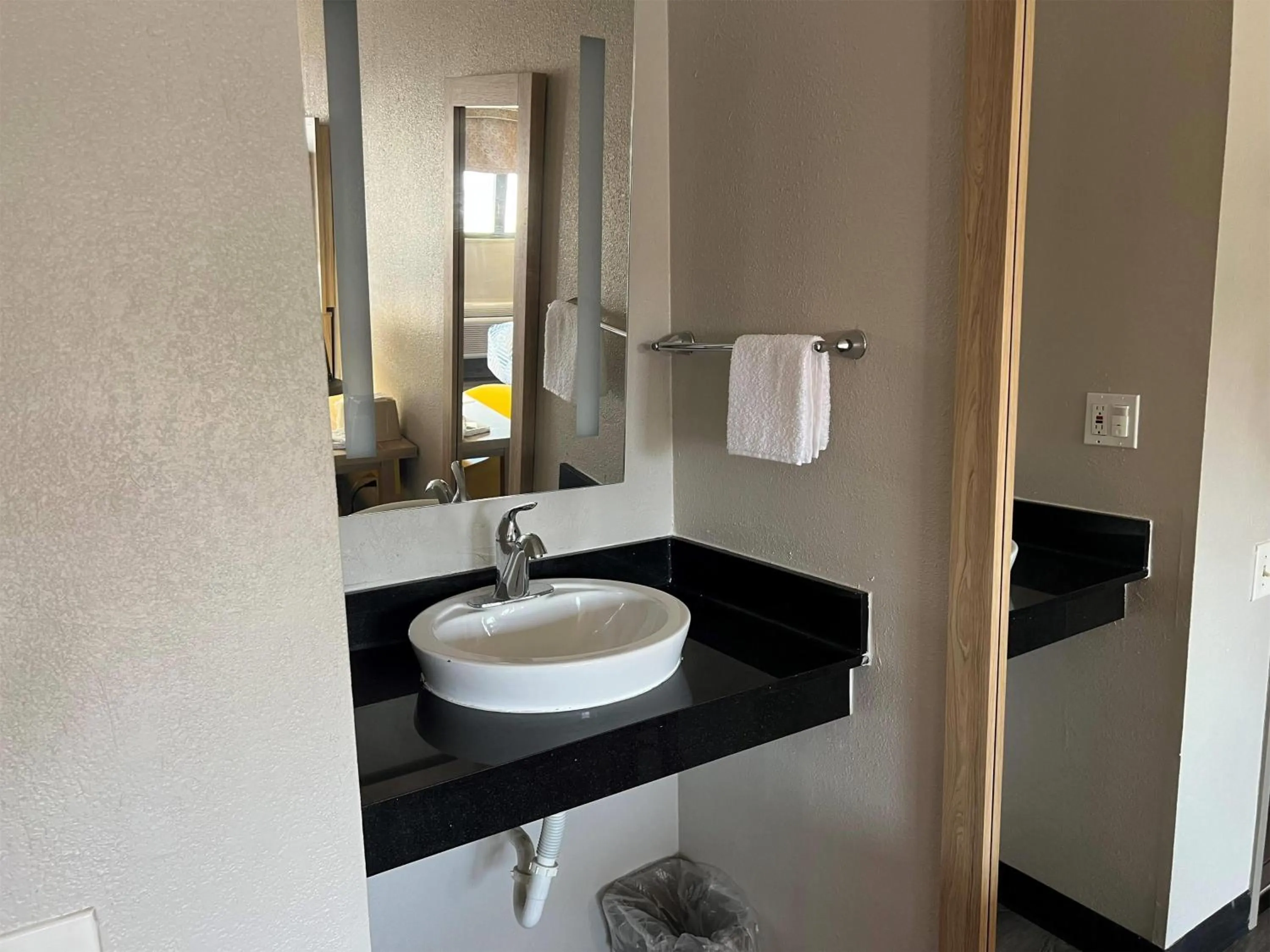 Bathroom in Days Inn by Wyndham Kansas City Northeast