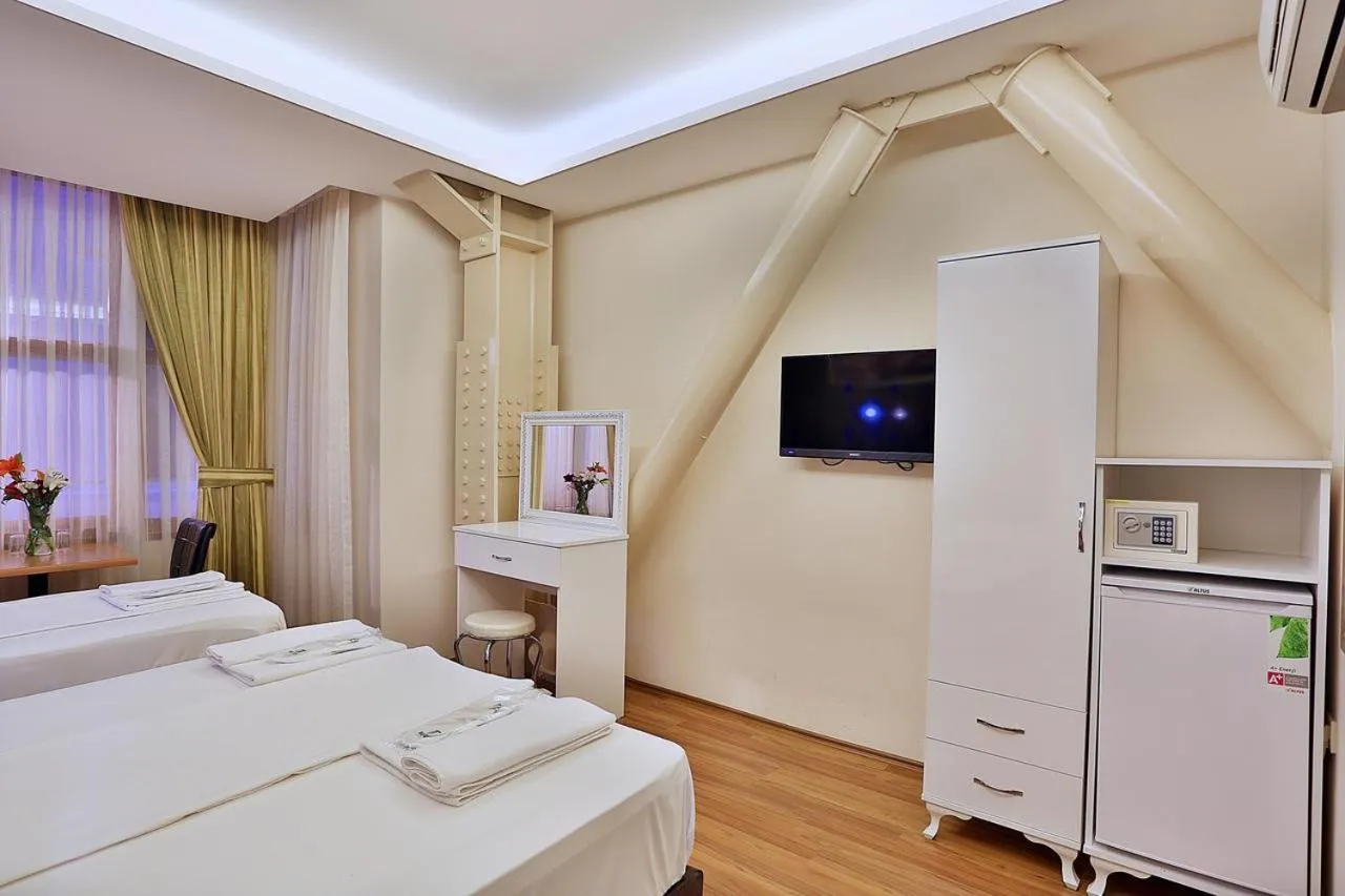 Bed in Gh Suites Taxim Hotel