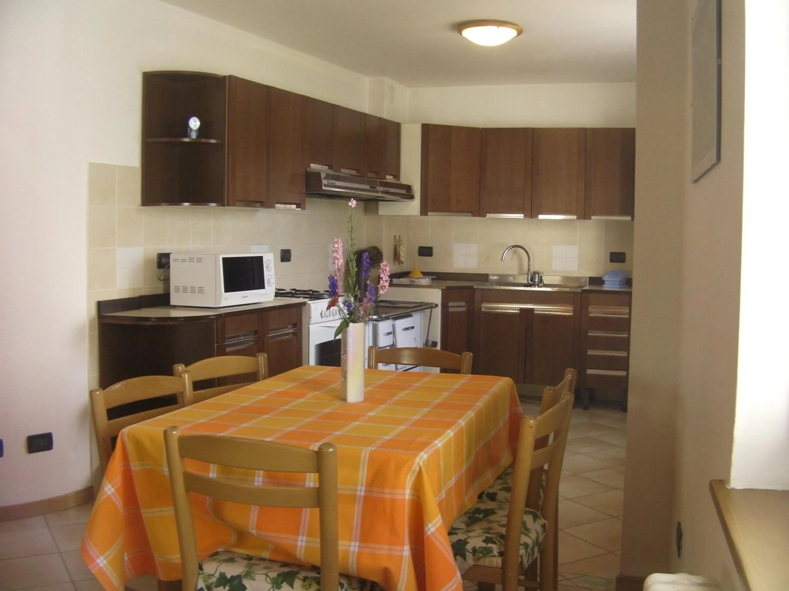 Kitchen or kitchenette in Appartamenti Rumo