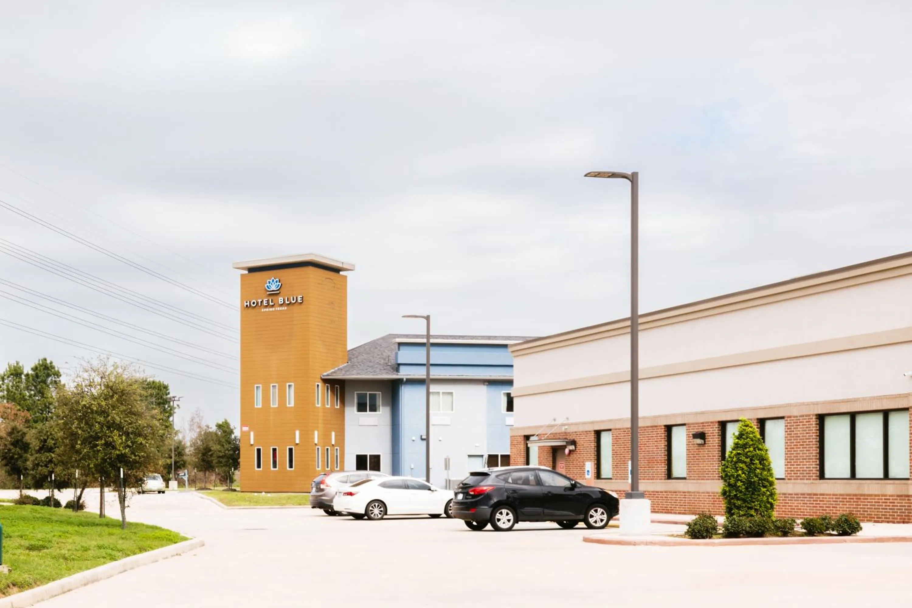 Property building in Super 8 by Wyndham Spring/North Houston