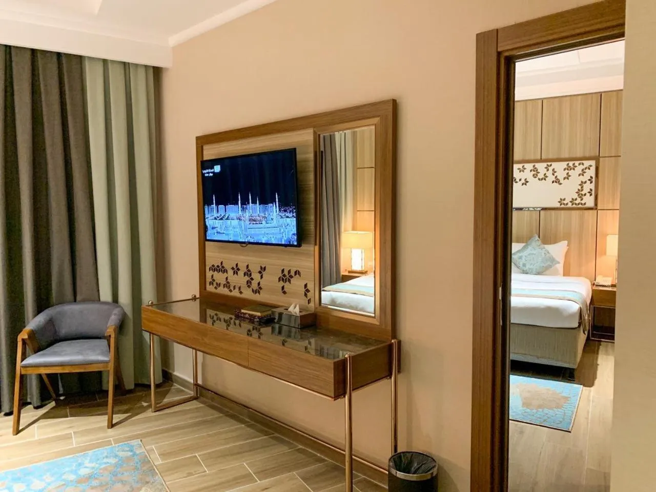 Communal lounge/ TV room, Bed in Midan Hotel & Suites Al Aziziya