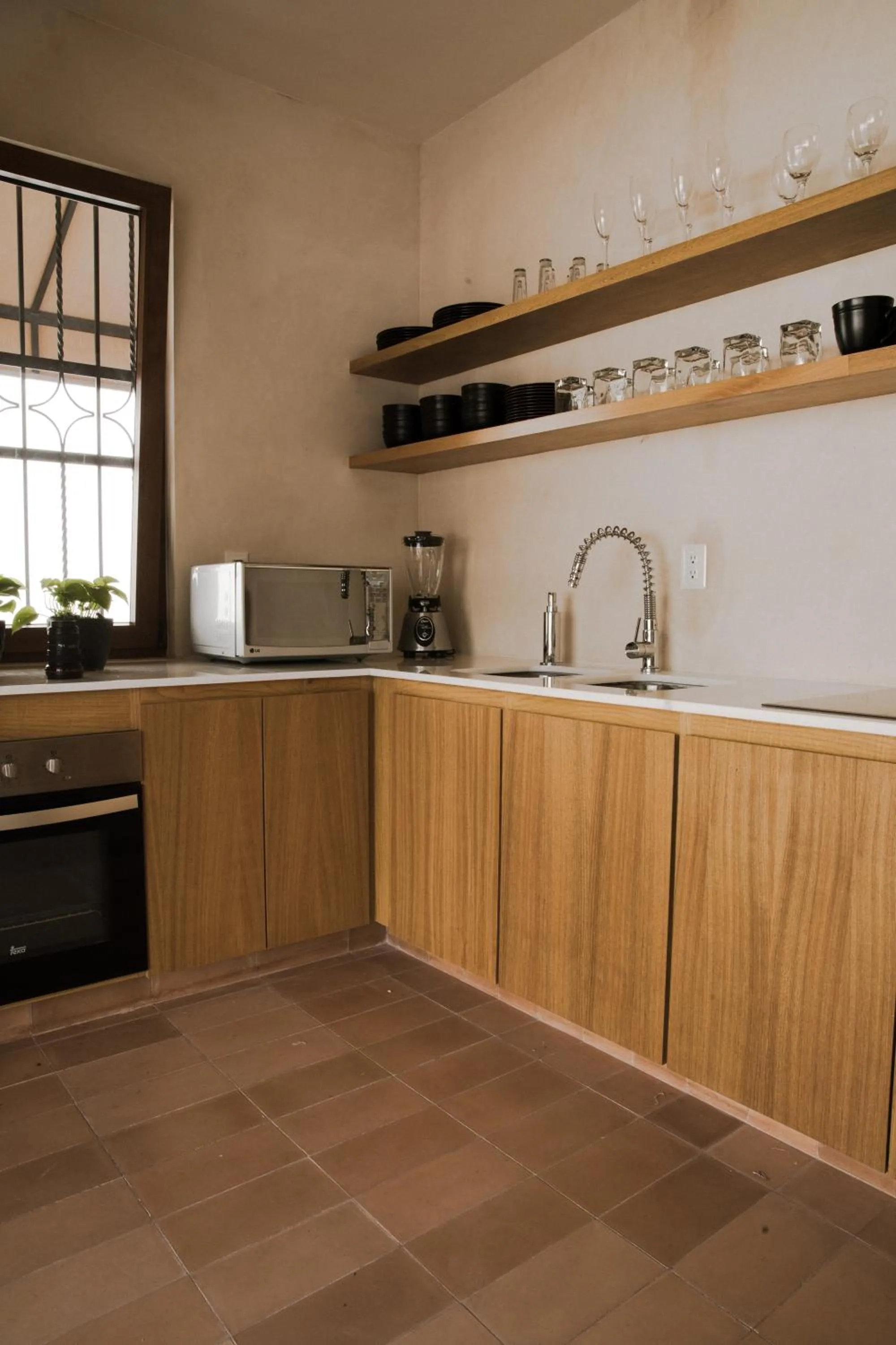 Communal kitchen in Casa Montore by Barrio Mexico
