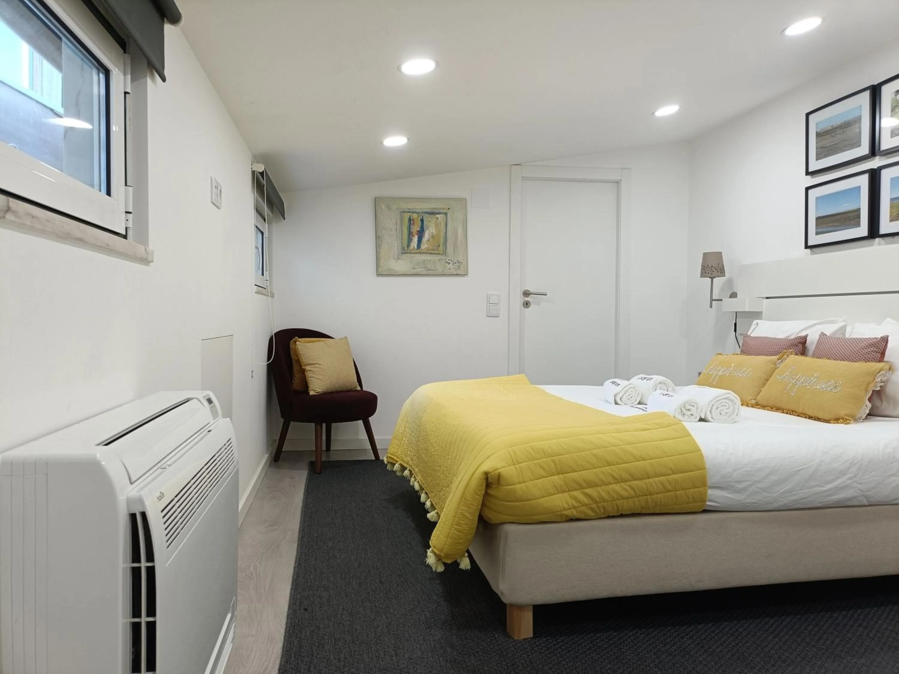 Bed in DoBairro Suites at Merces