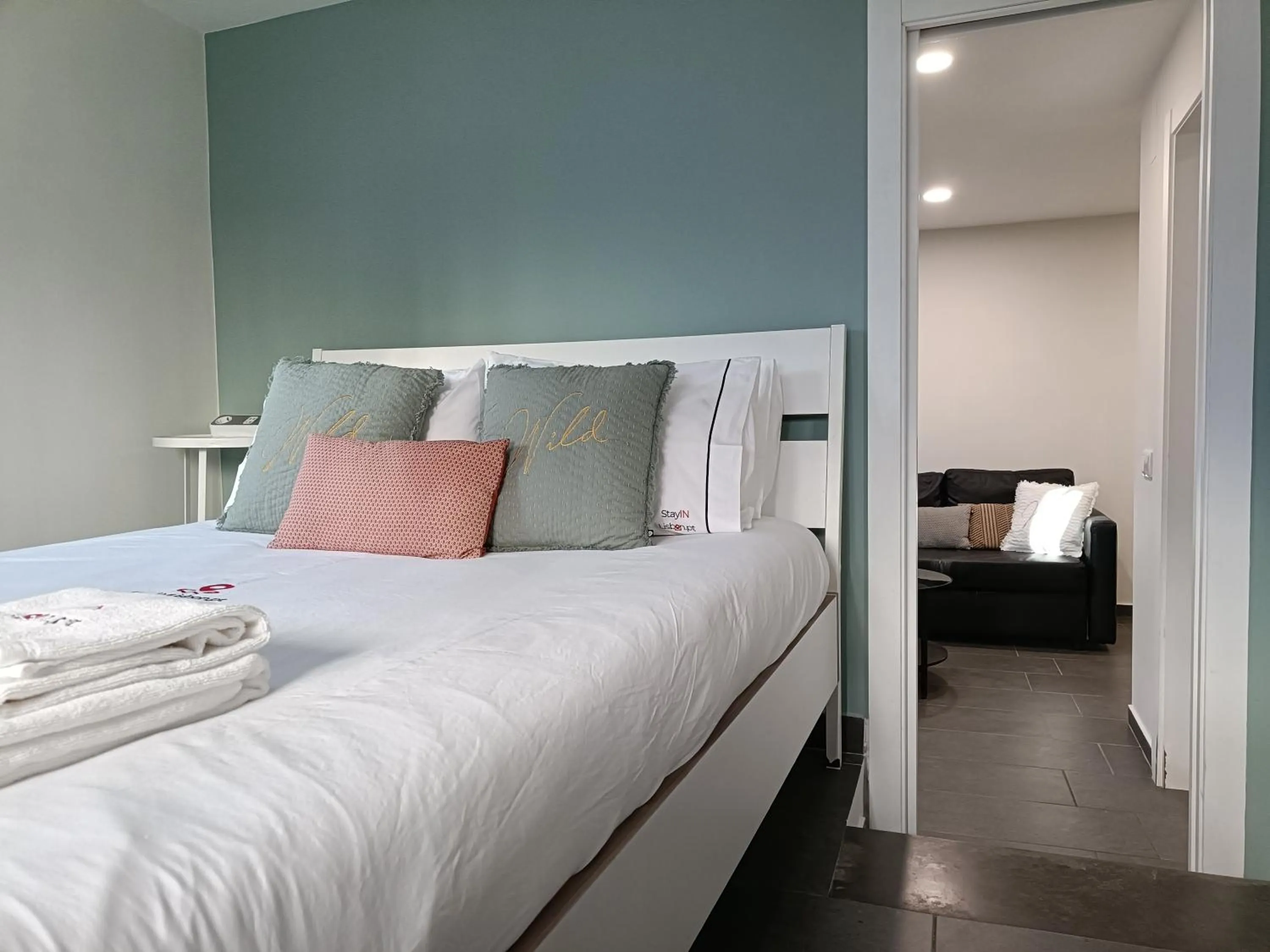 Bed in DoBairro Suites at Merces