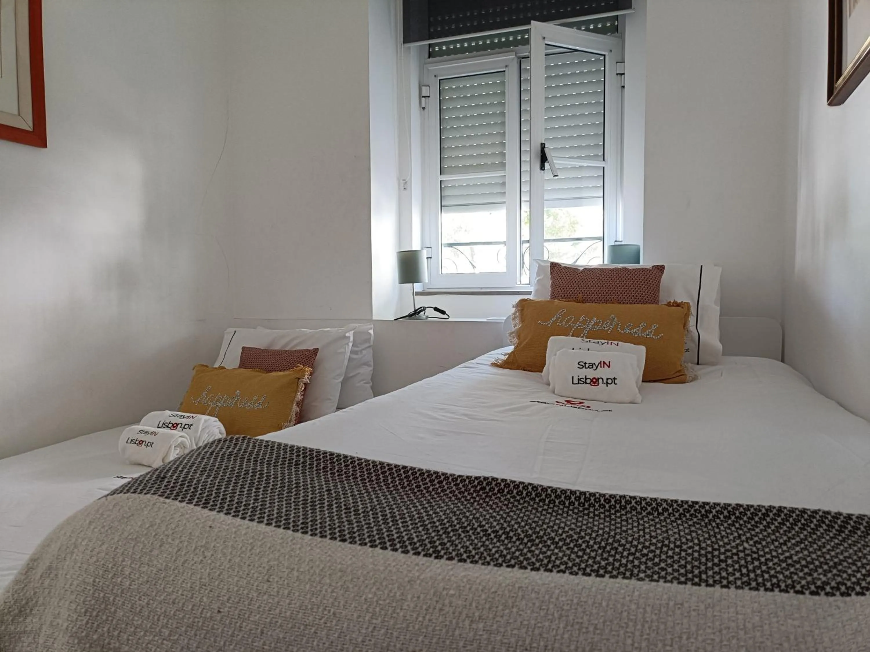 Bed in DoBairro Suites at Merces