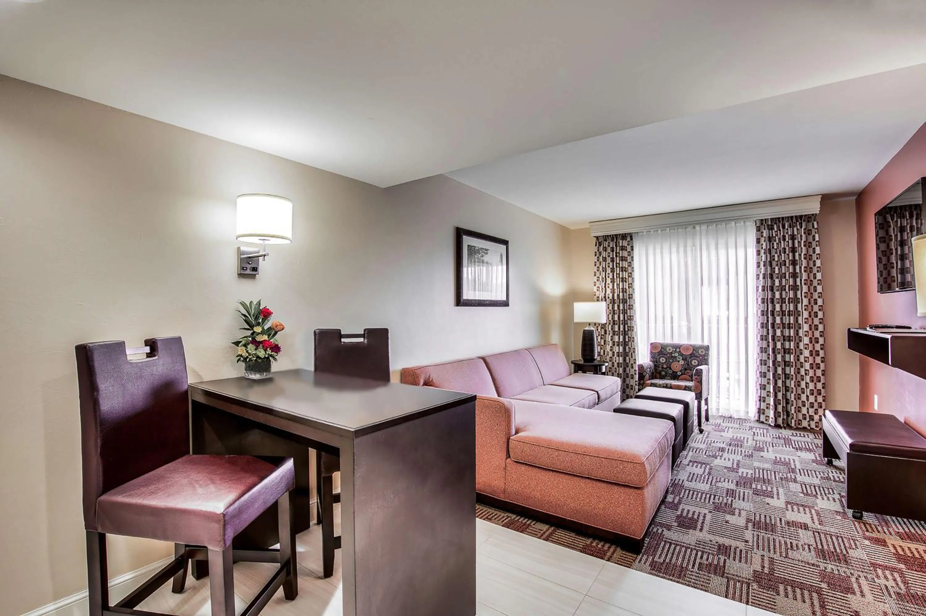 Seating area in Inn of Naples, Tapestry Collection by Hilton