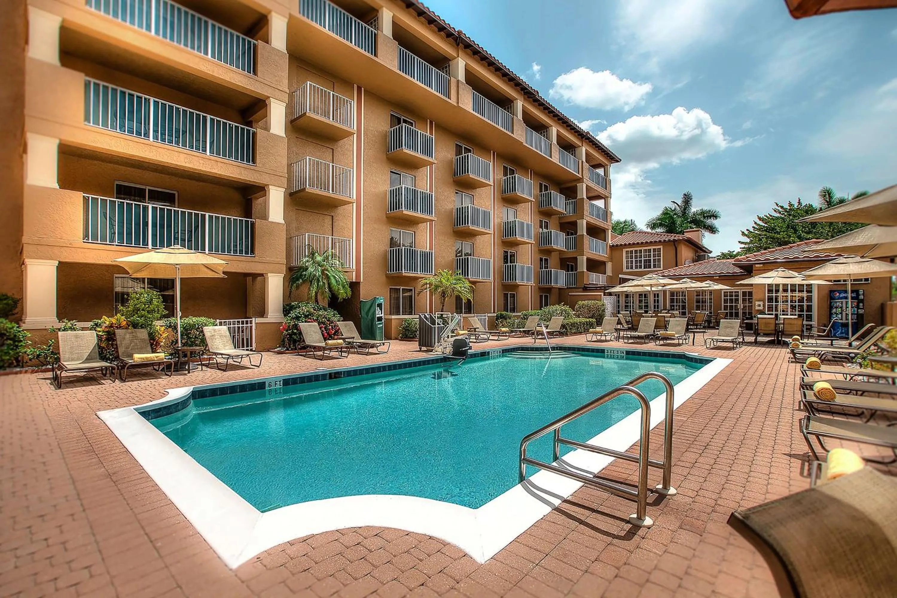 Pool view in Inn of Naples, Tapestry Collection by Hilton