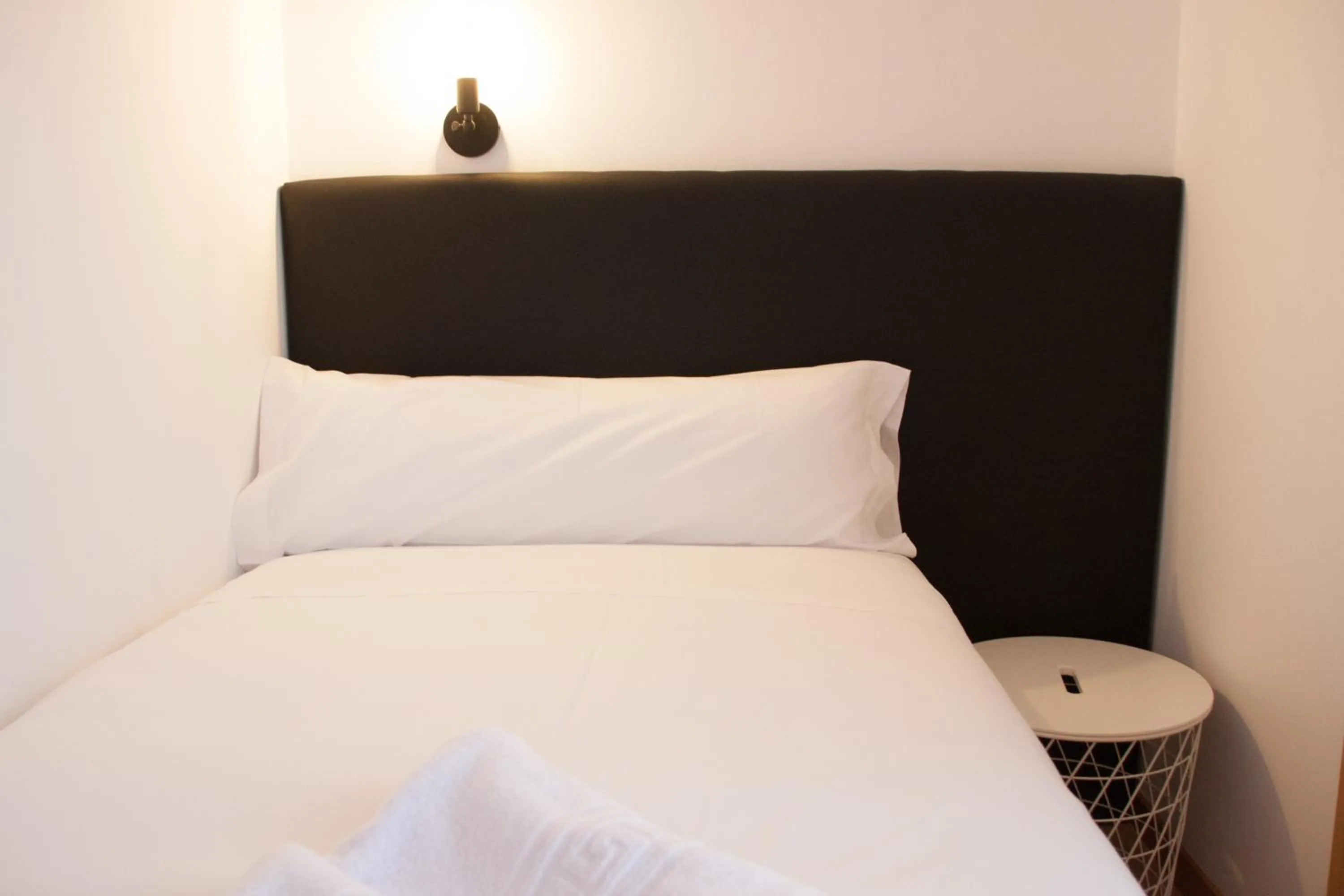 Bed in Hostal Cuéntame Evolución Auto Check in