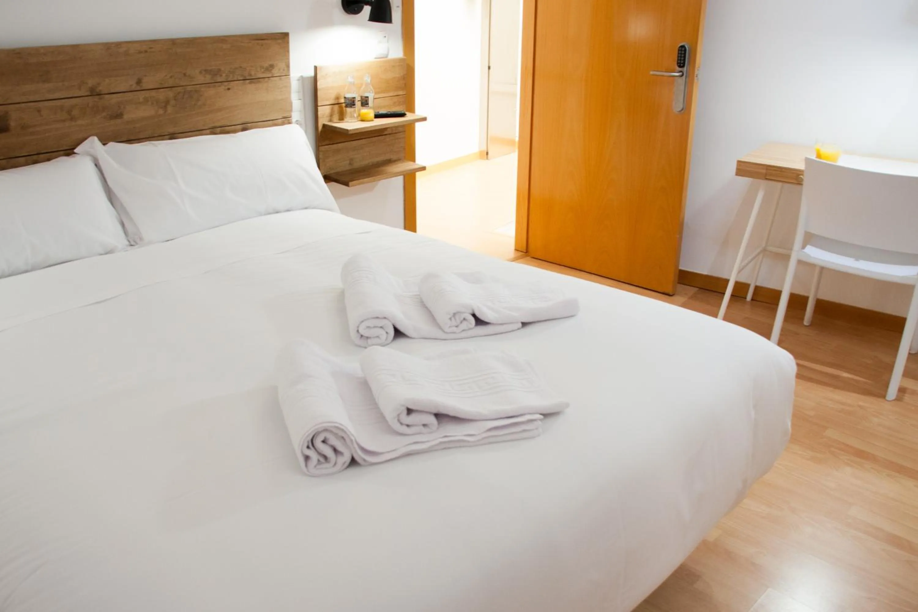 Bed in Hostal Cuéntame Evolución Auto Check in