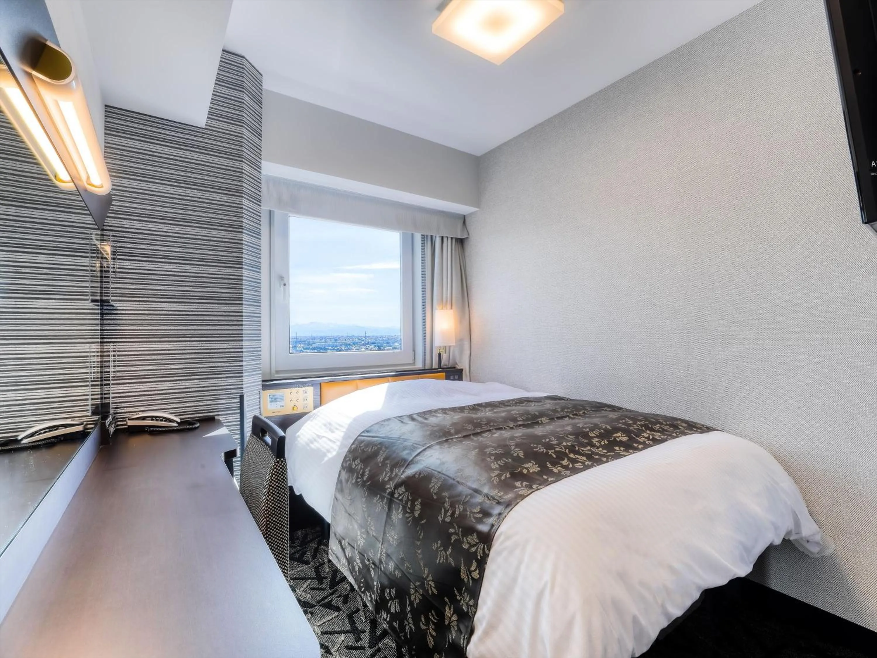 Photo of the whole room, Bed in APA Hotel Takaoka Ekimae