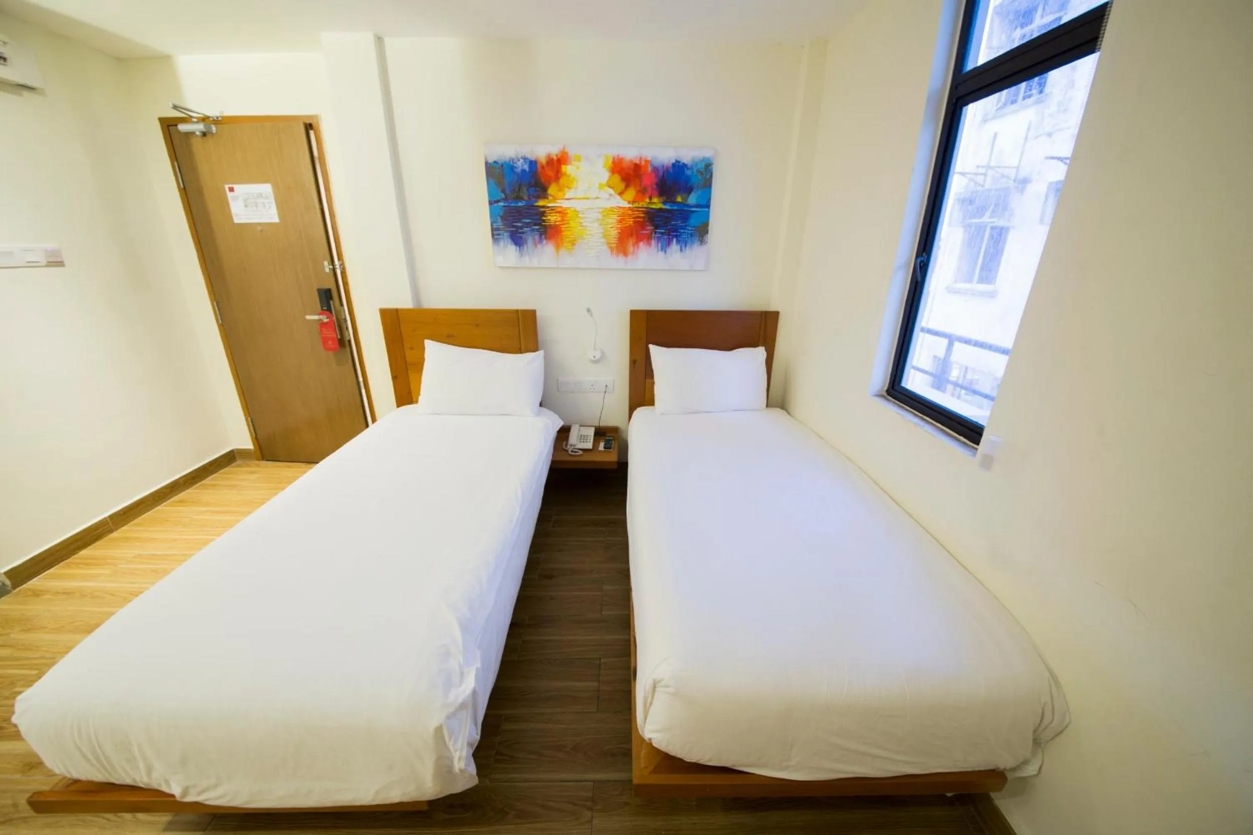 Bed in The Point Boutique Hotel