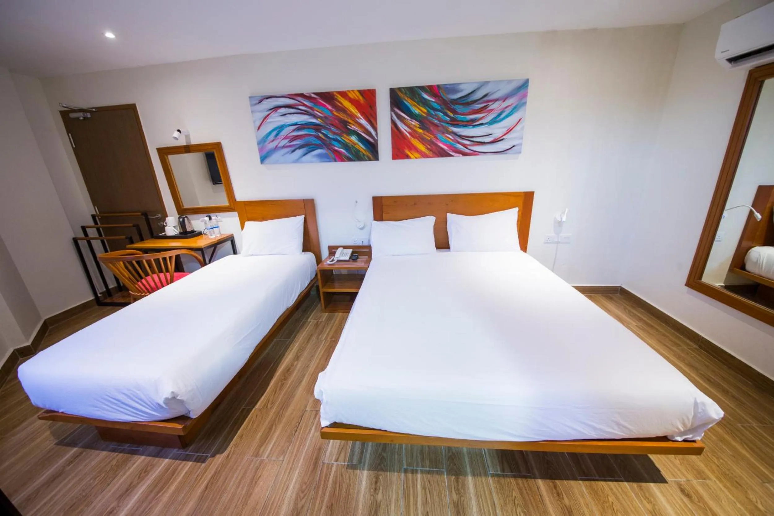 Bed in The Point Boutique Hotel