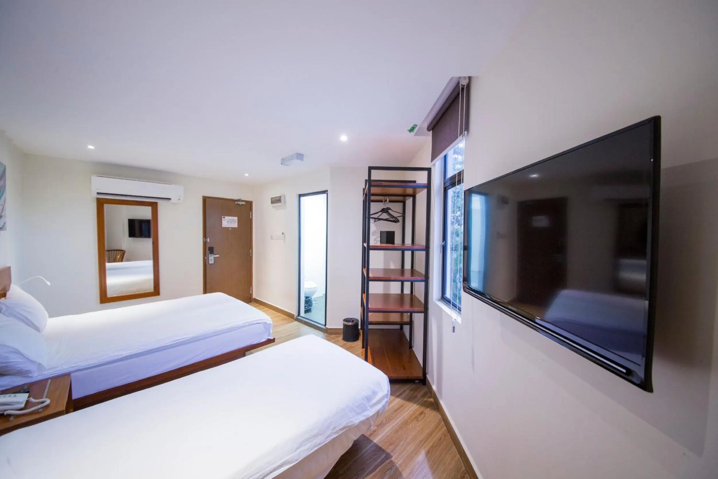 Bed in The Point Boutique Hotel