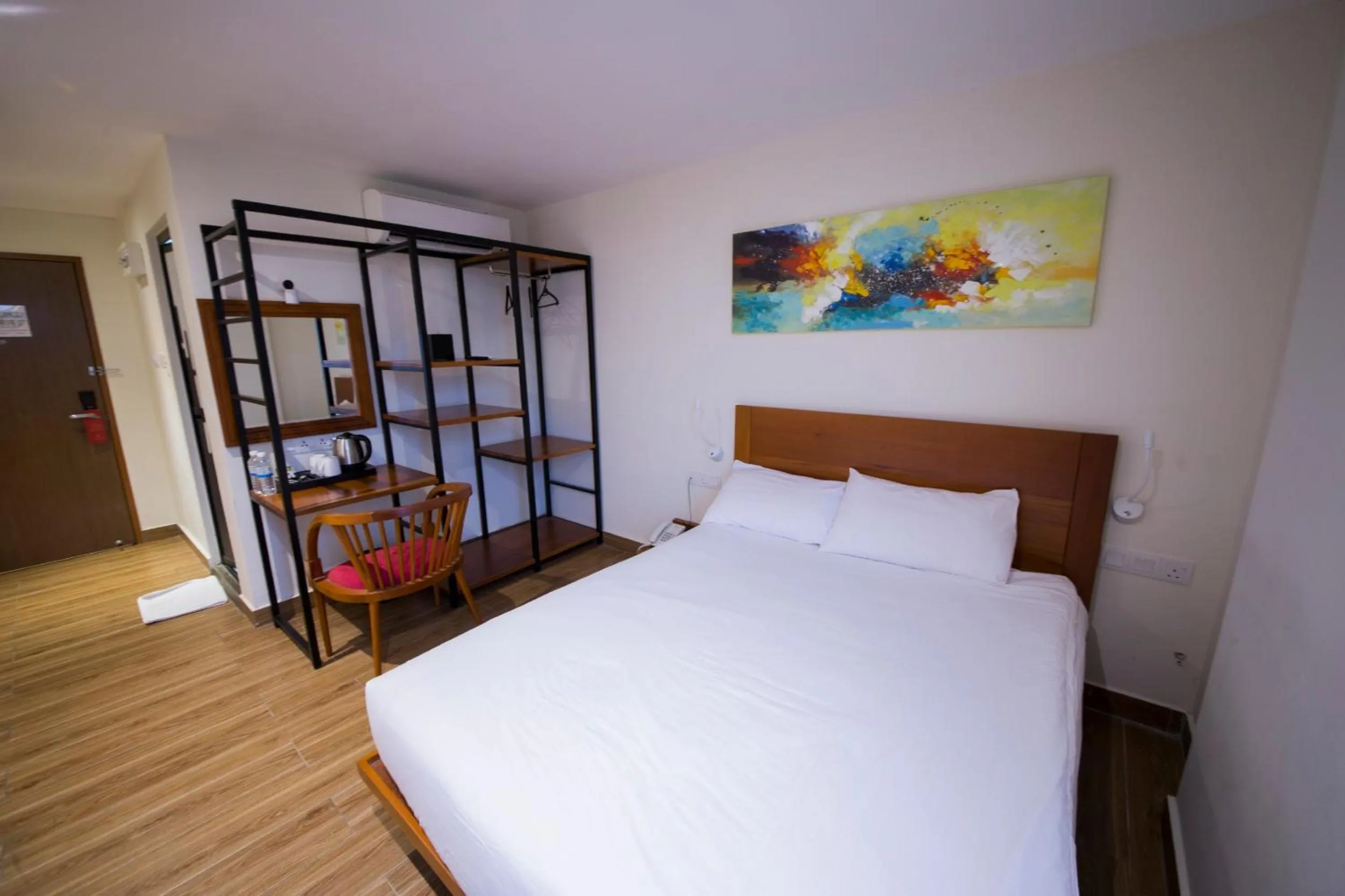 Bed in The Point Boutique Hotel