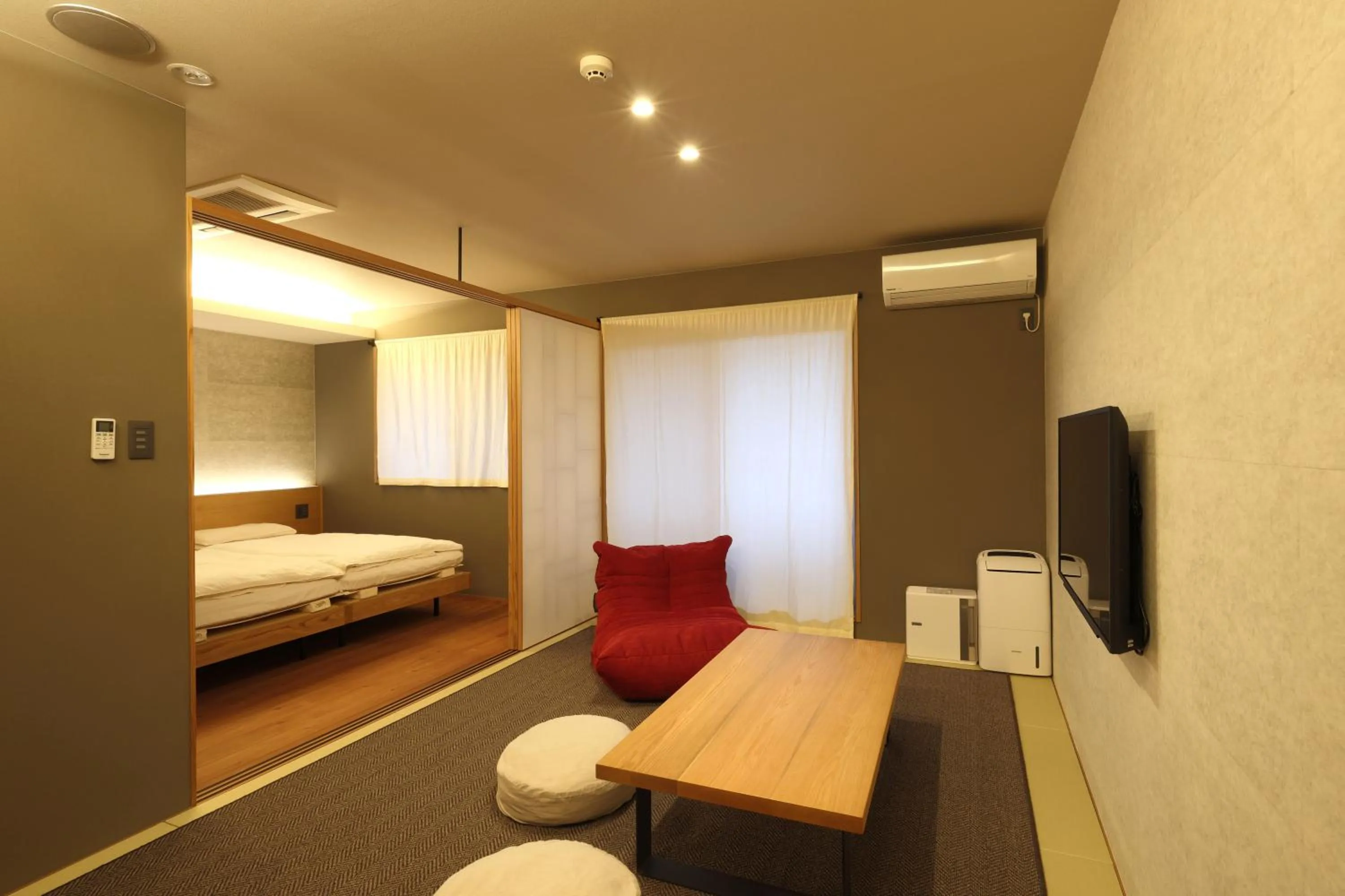 Living room, Bed in Neon Hotel - Luxury Sleep Retreat -