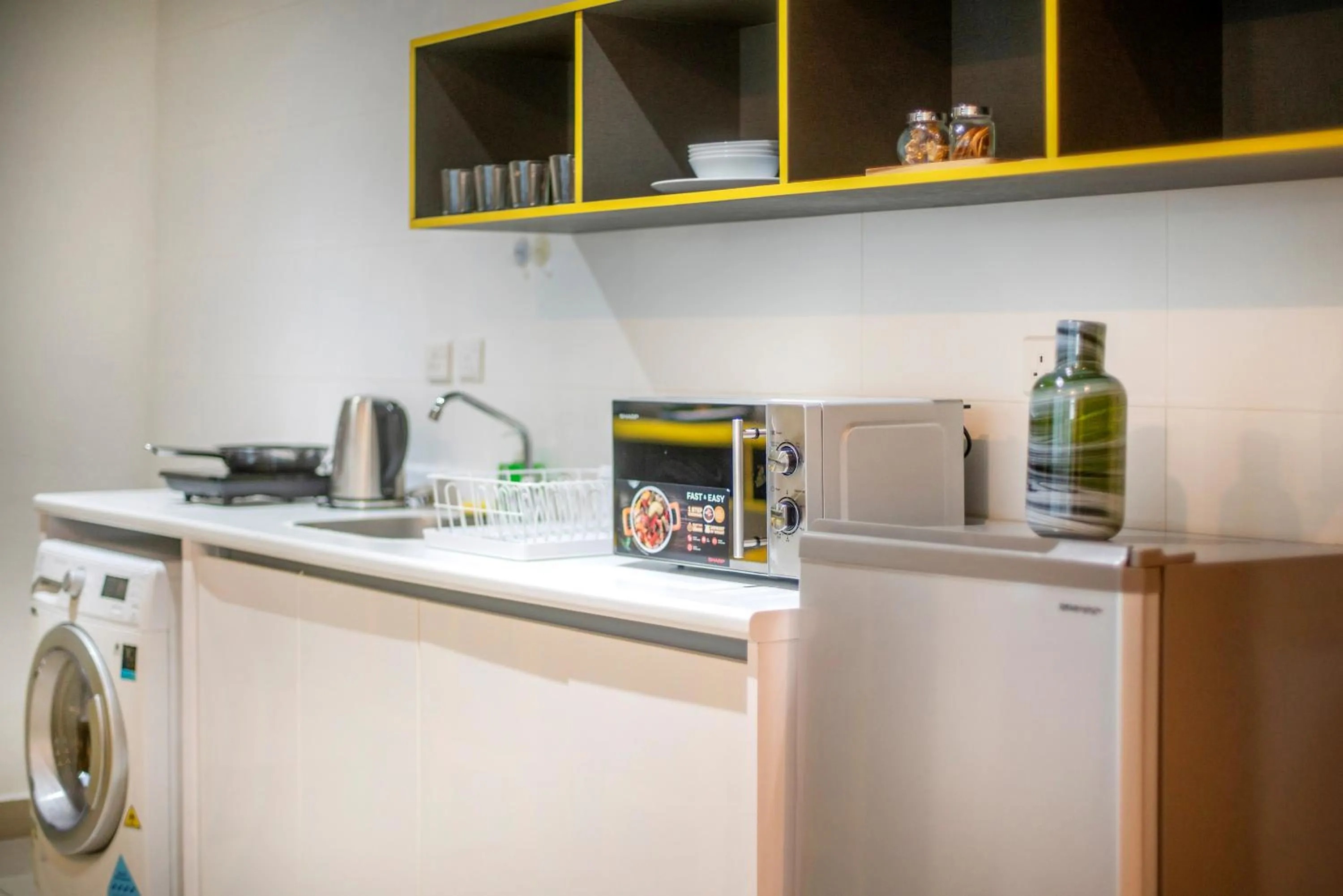 Kitchen or kitchenette in Arte Plus KLCC Designer Suites by Cobnb