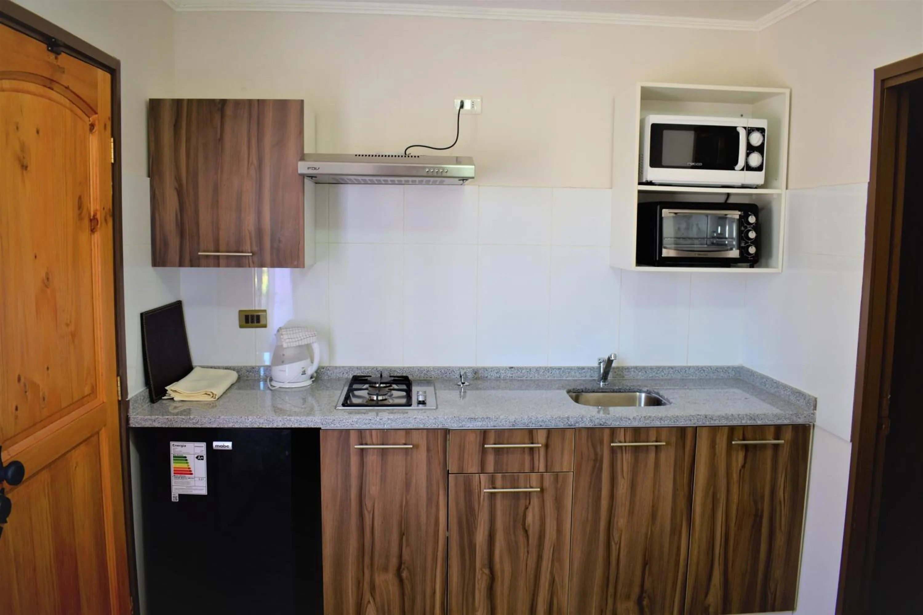 Kitchen or kitchenette in Apart Hotel Y Cabanas Vegasur