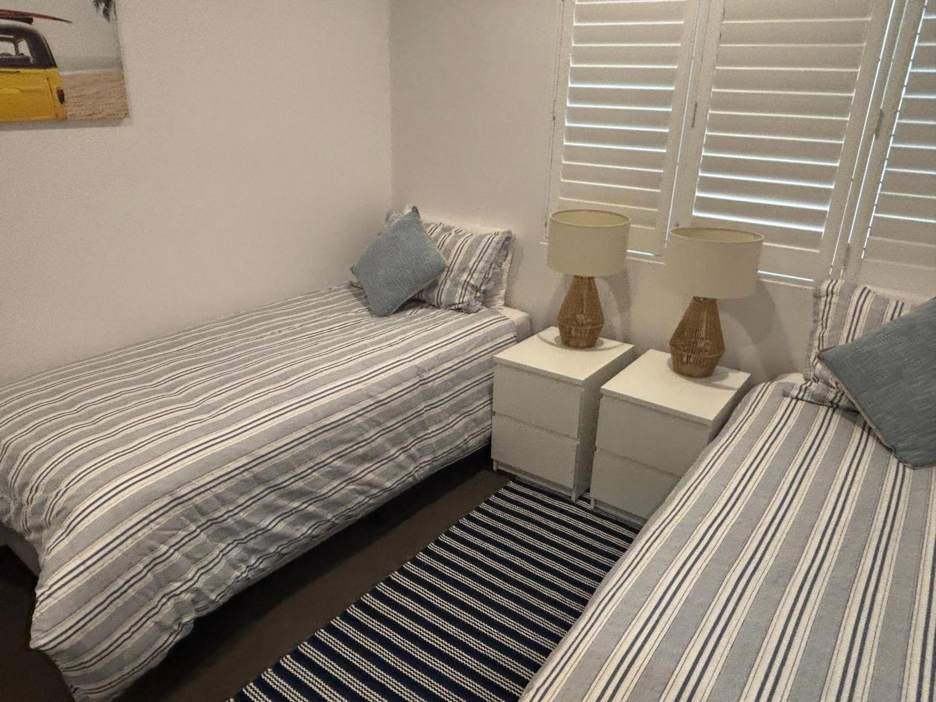 Bed in Aqua Promenade Beachfront Holiday Apartments