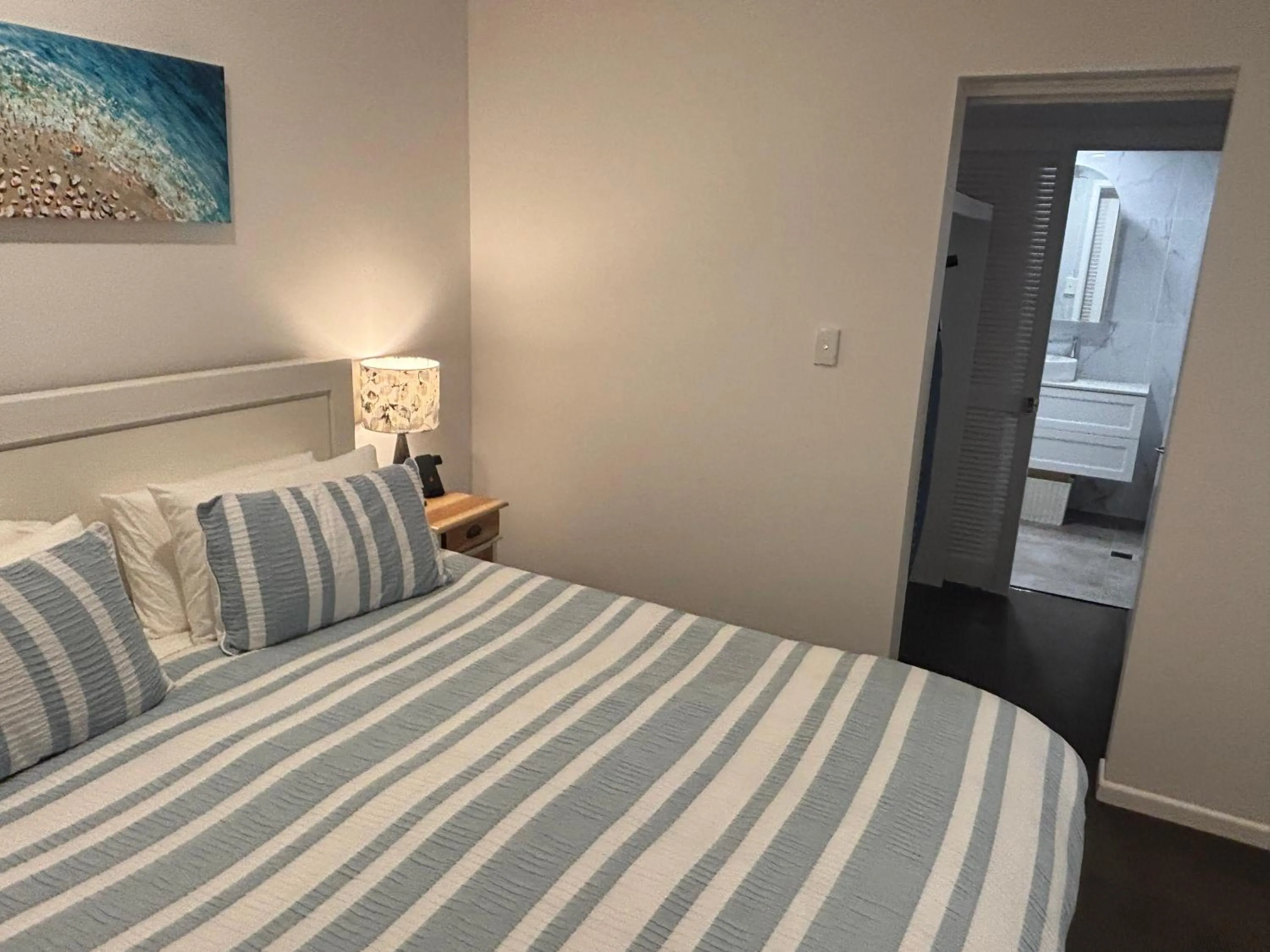 Bed in Aqua Promenade Beachfront Holiday Apartments