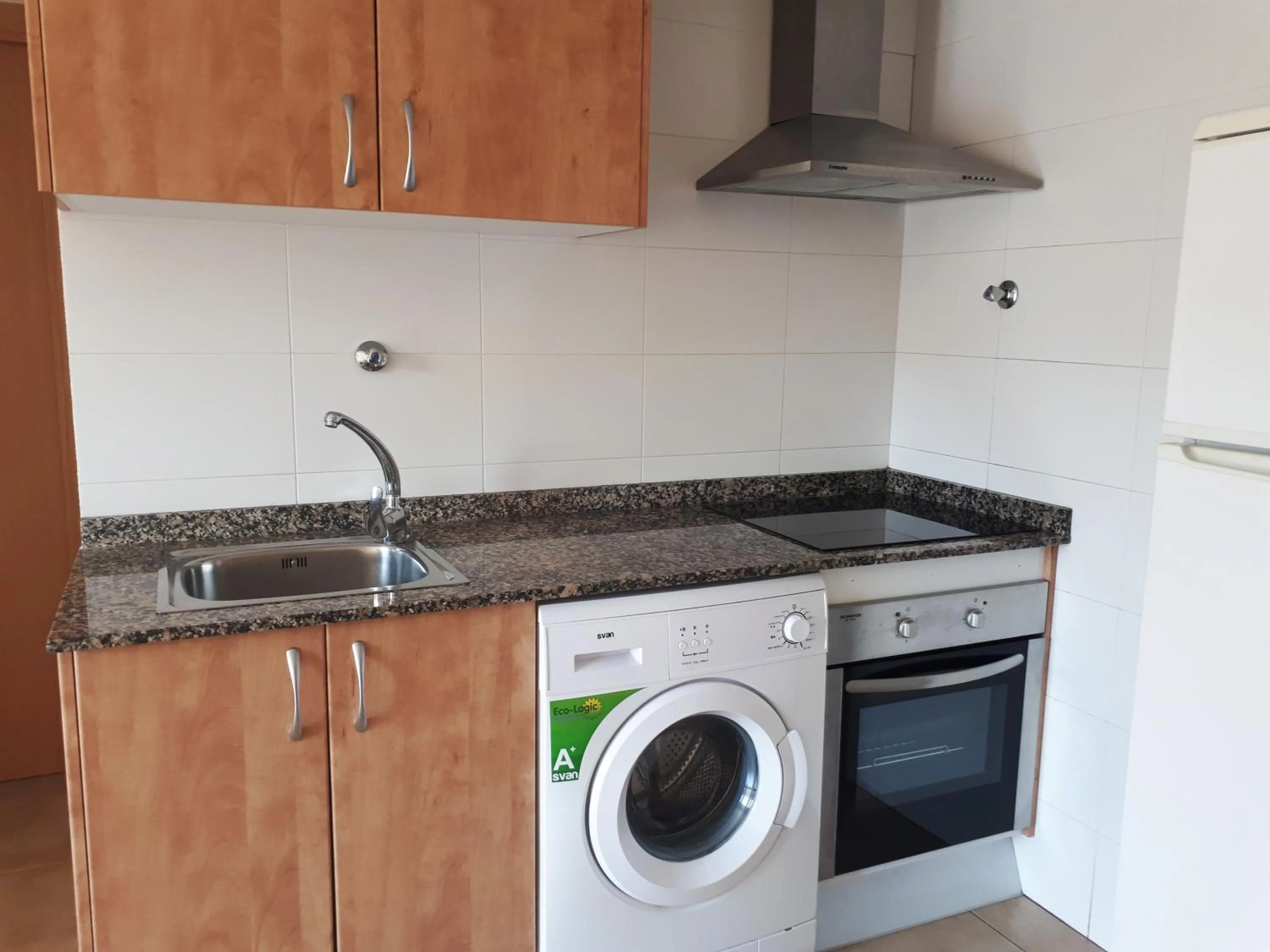 Kitchen or kitchenette in Apartamentos Doña Carmen 3000