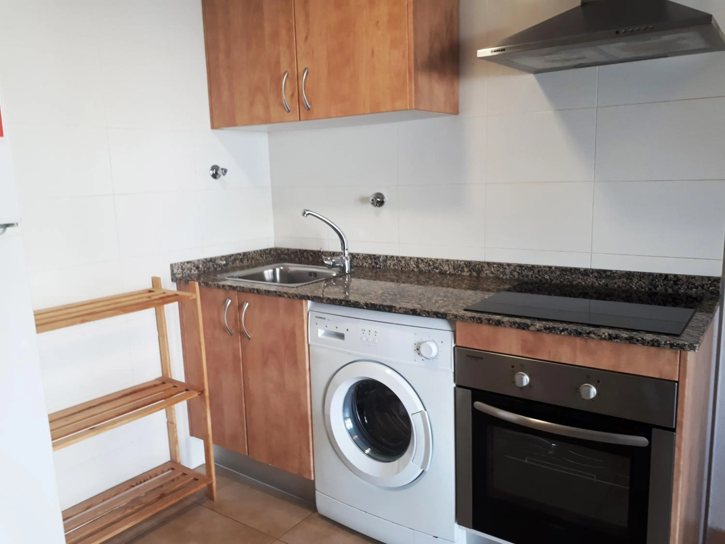 Kitchen or kitchenette in Apartamentos Doña Carmen 3000