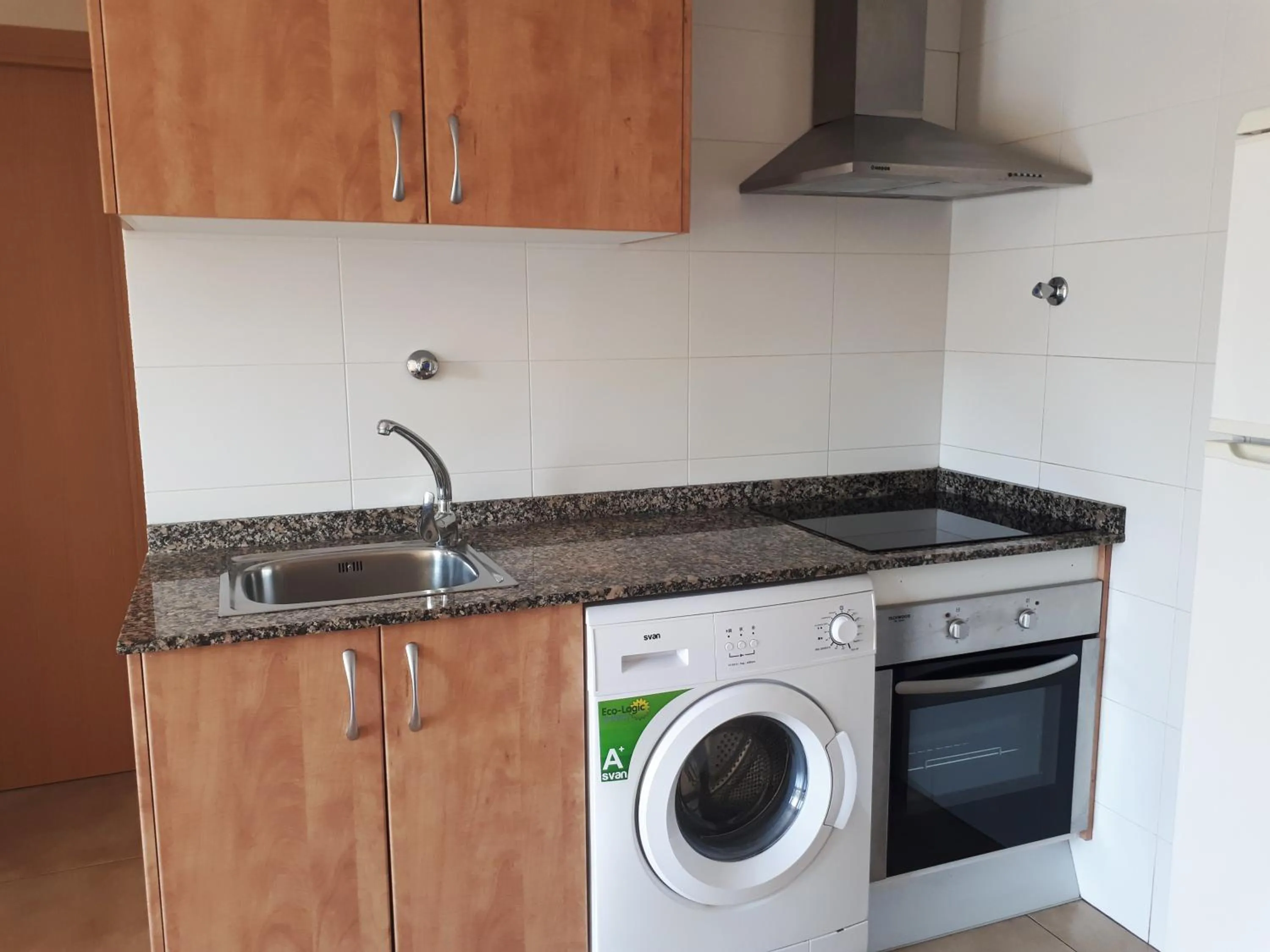 Kitchen or kitchenette in Apartamentos Doña Carmen 3000