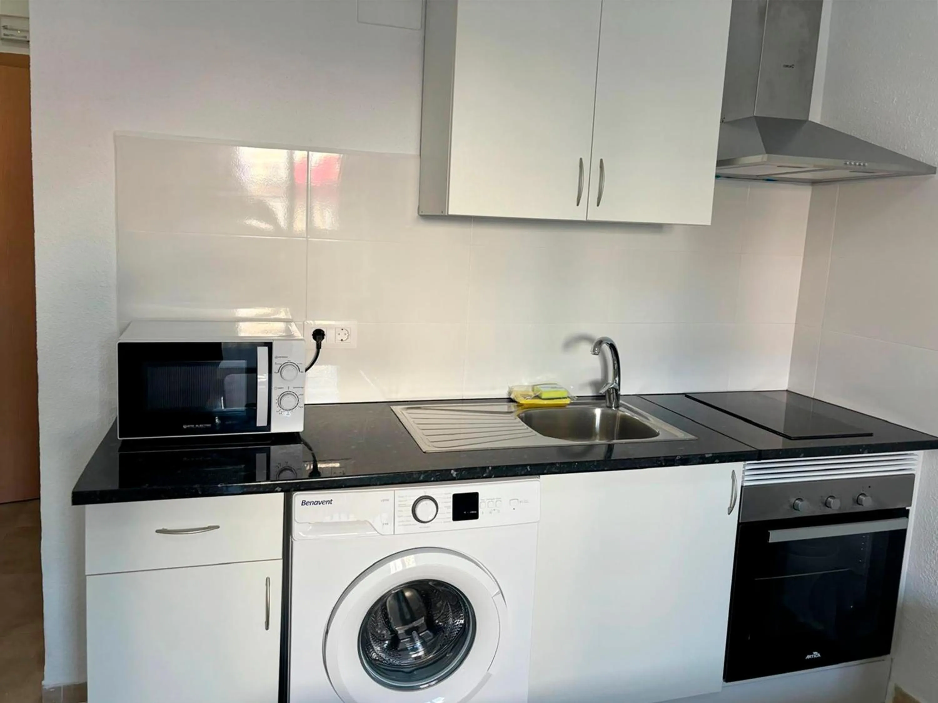 Kitchen or kitchenette in Apartamentos Doña Carmen 3000