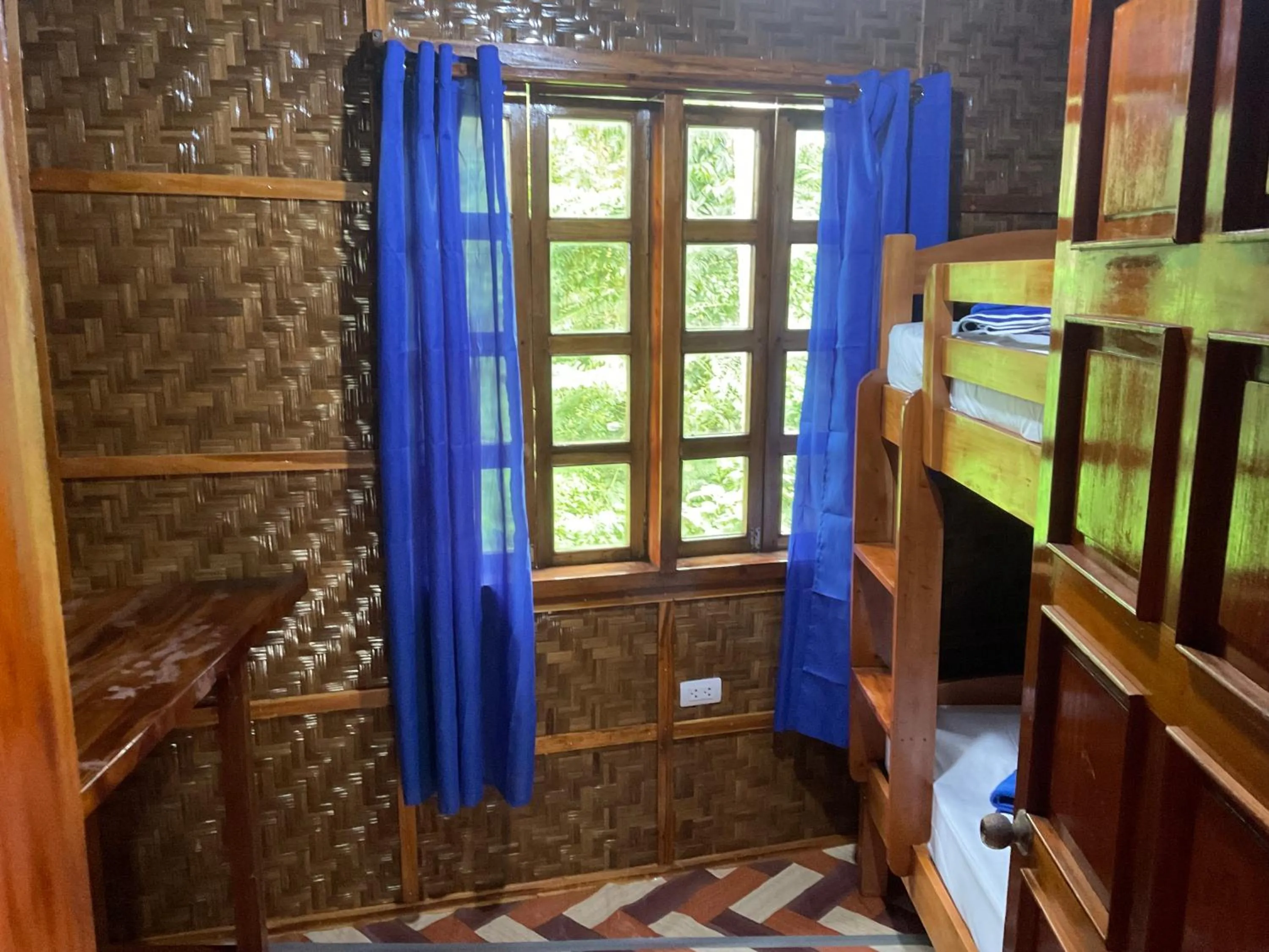 Bed in Rainbow Bay Beach & Dive Resort