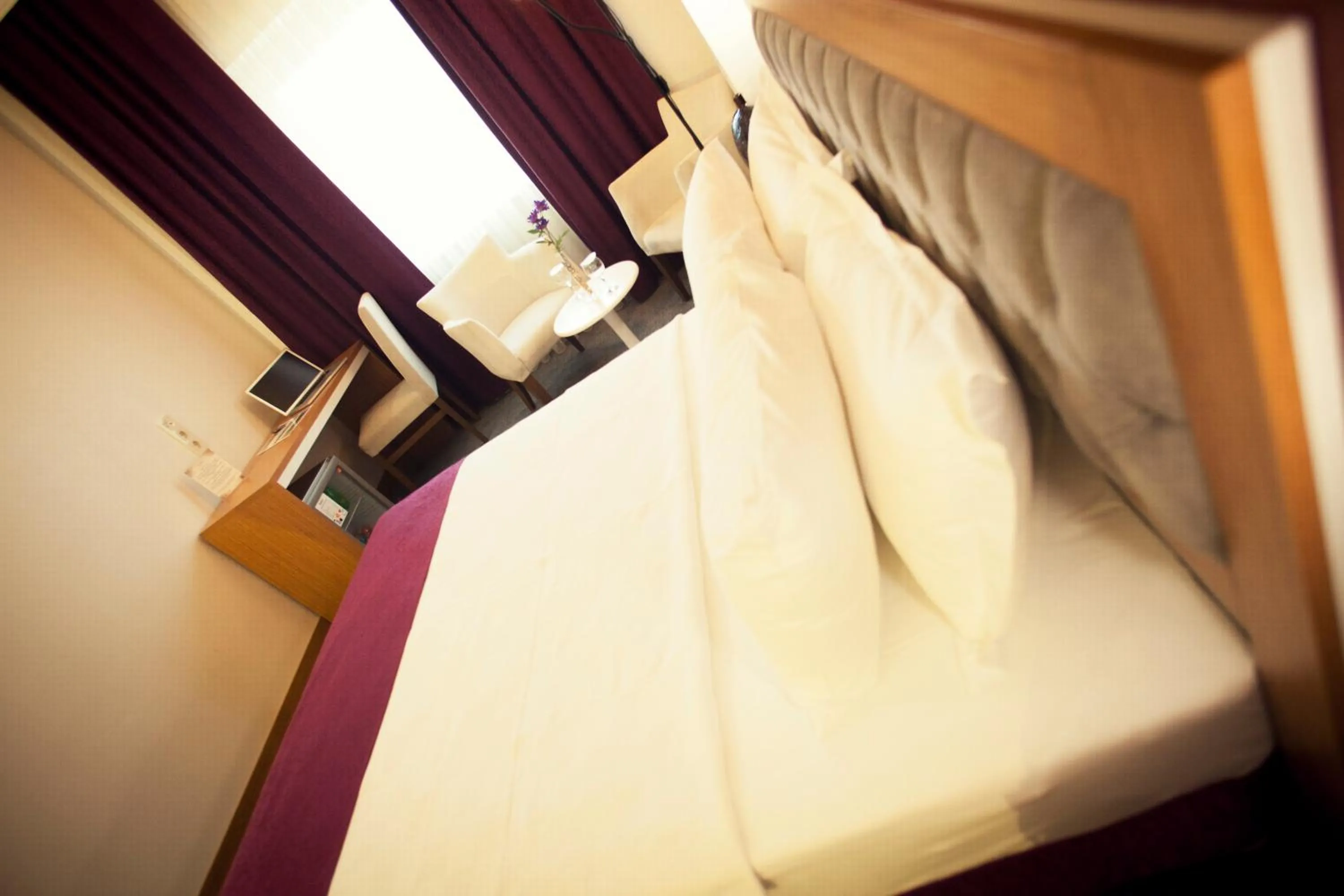 Bedroom in Helikon Business Hotel