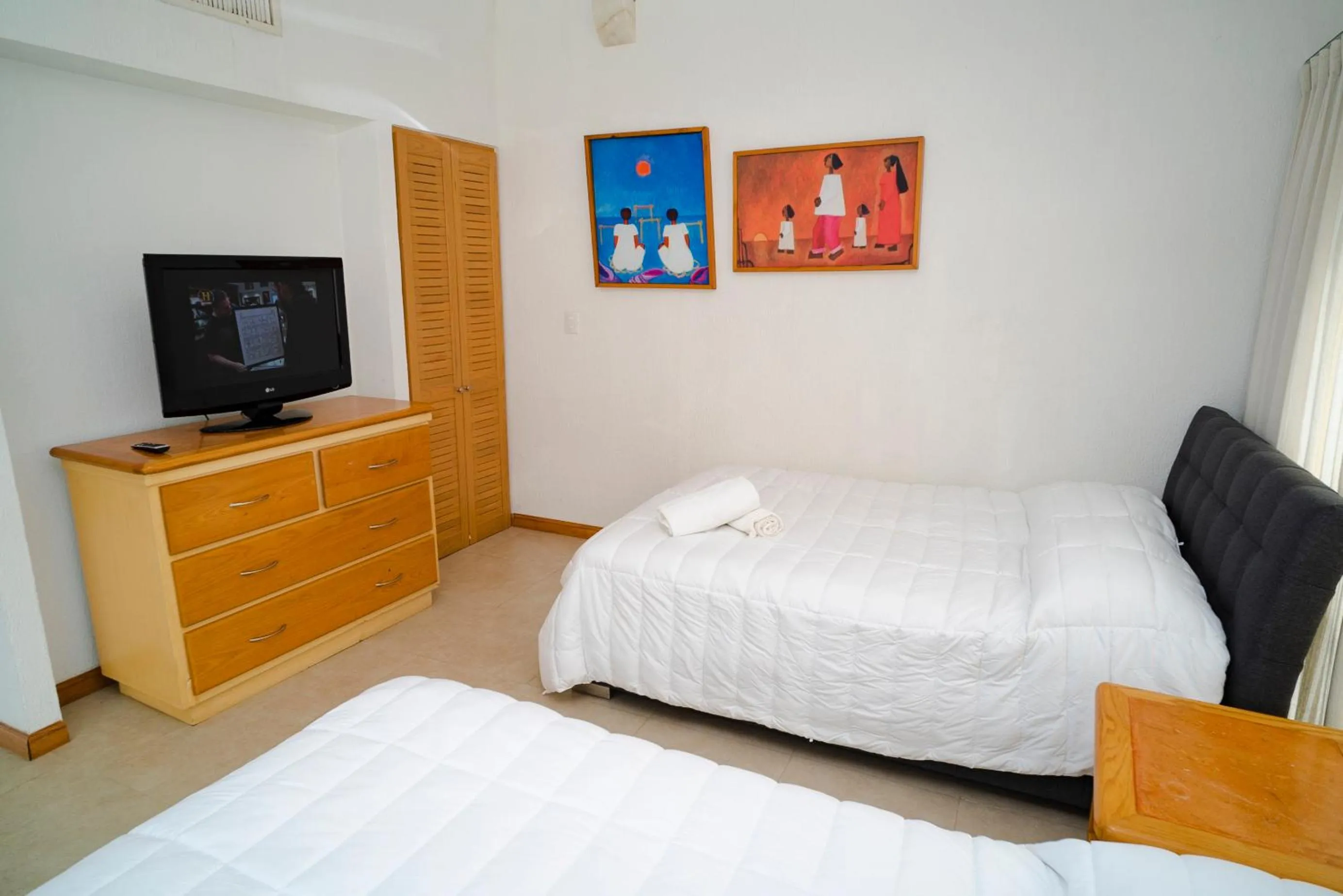 Bedroom, Bed in Oceanfront condo at voted best Cancun sandy beach