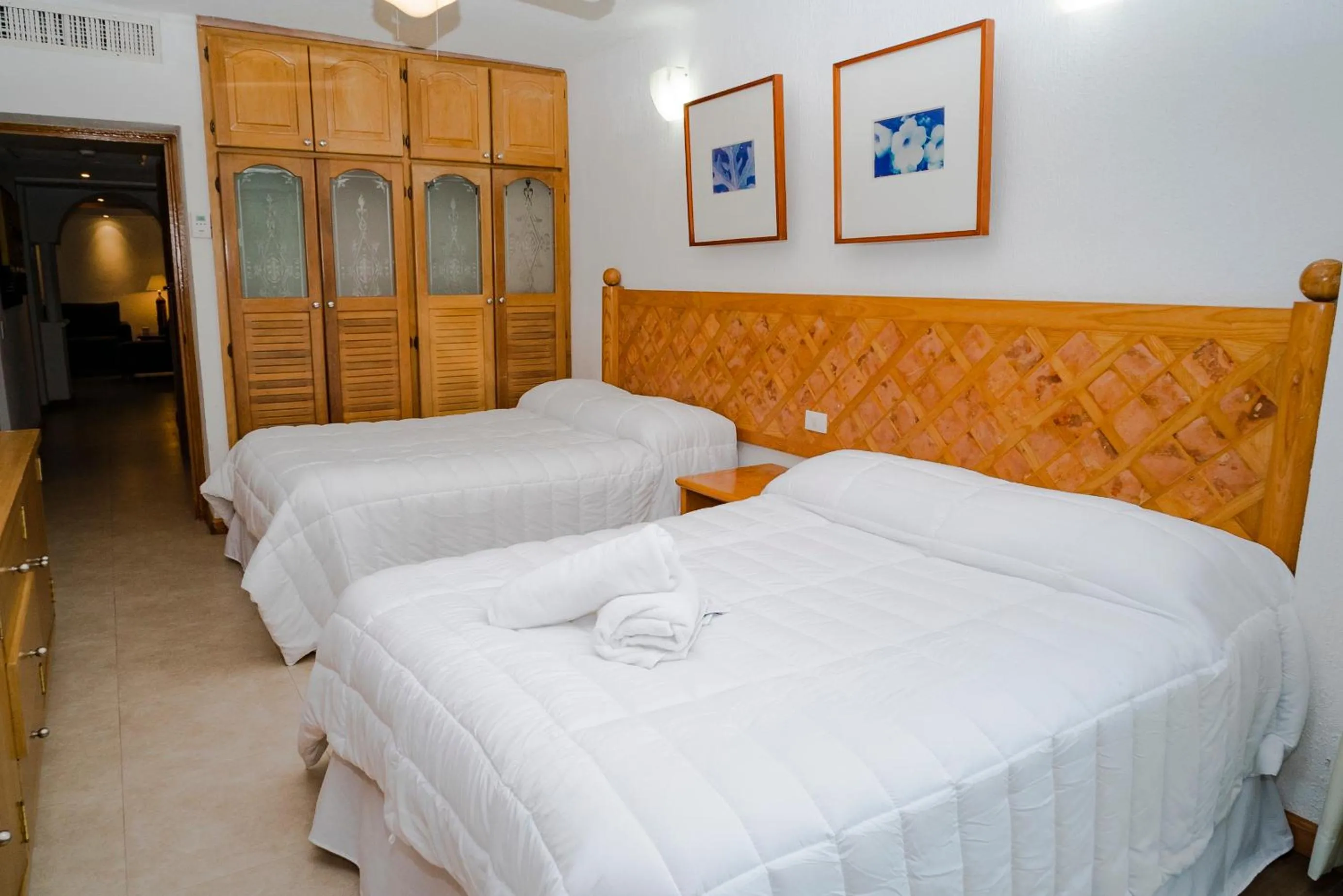 Bedroom, Bed in Oceanfront condo at voted best Cancun sandy beach