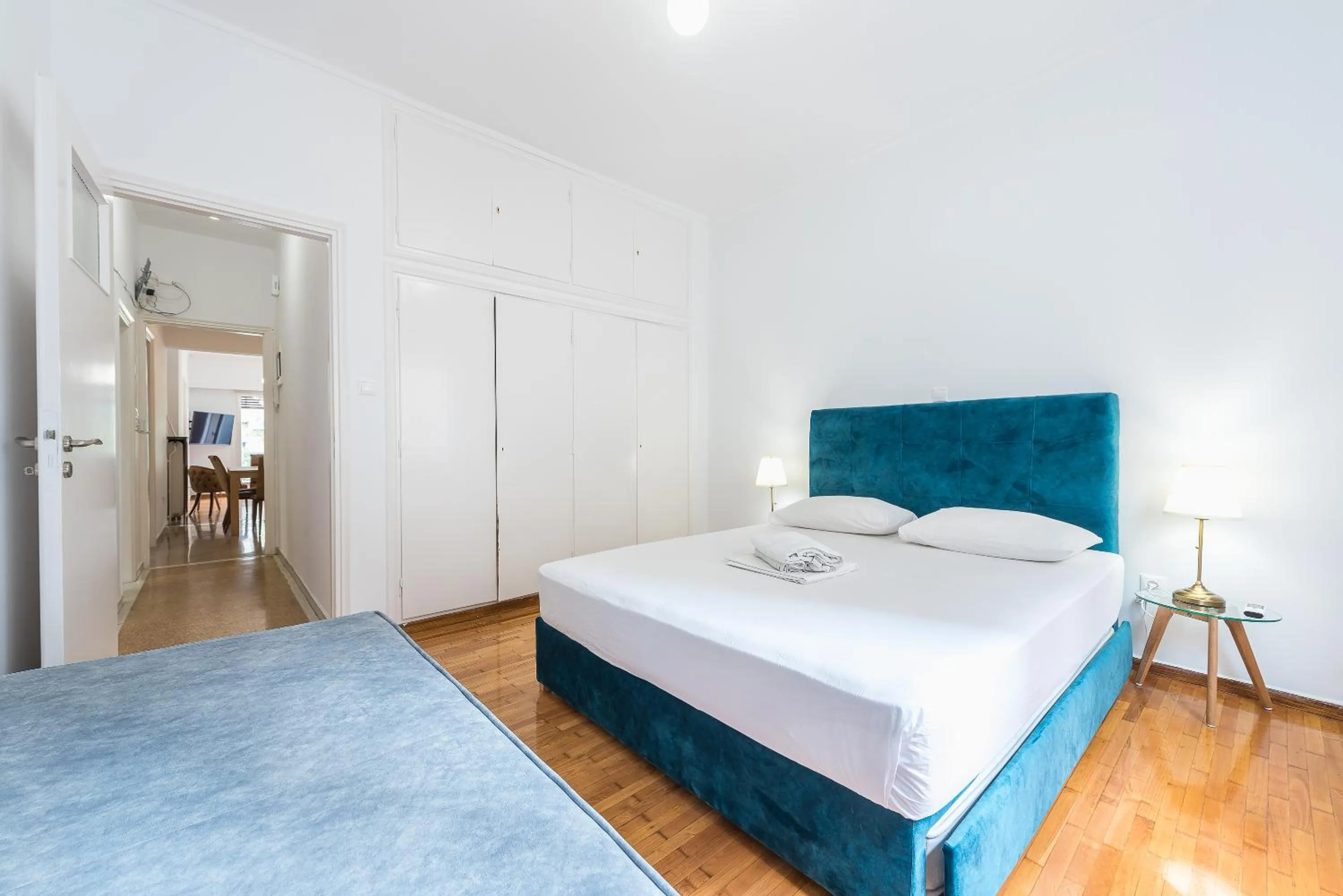 Bed in Victoria Queens Suites Apartments