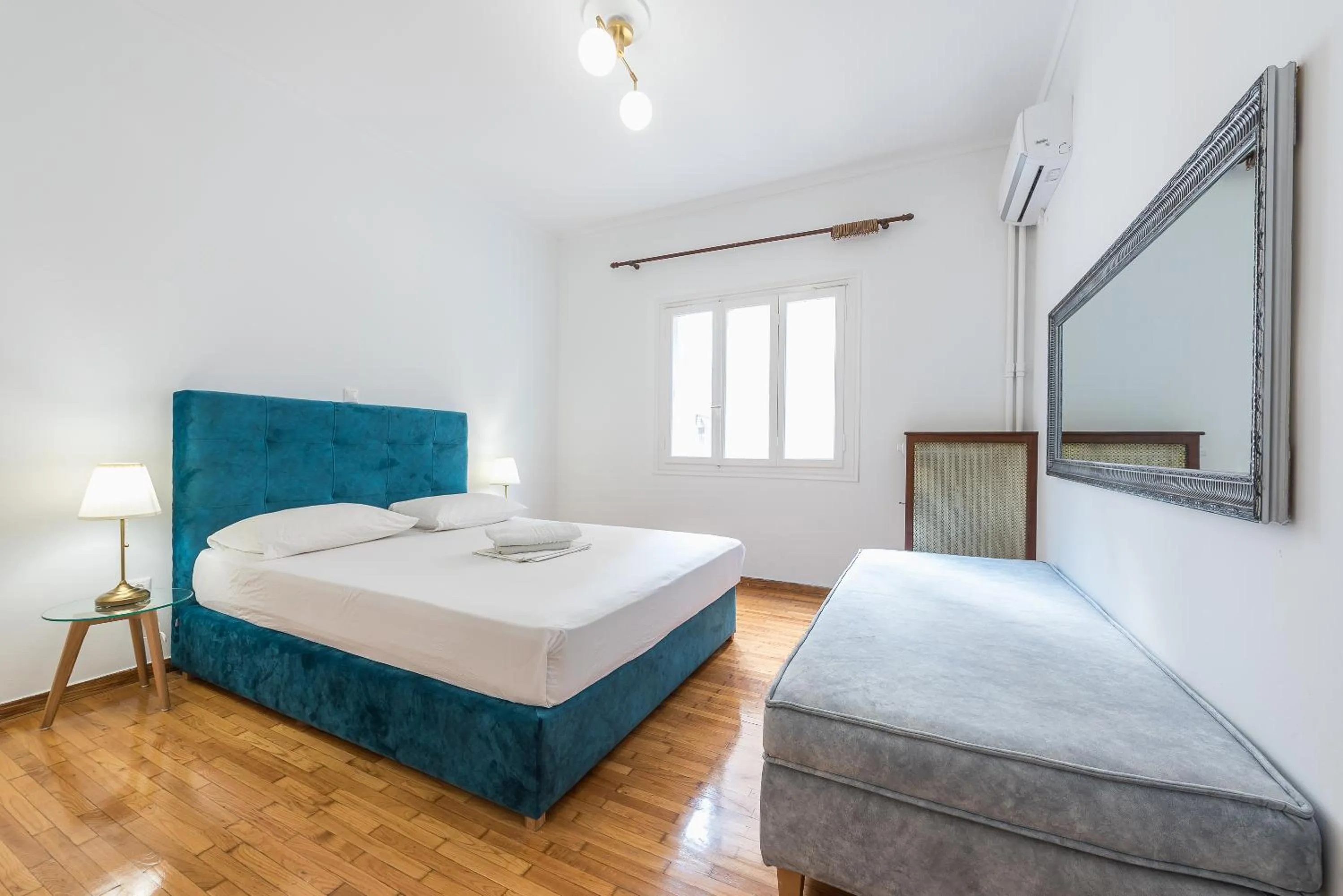 Bed in Victoria Queens Suites Apartments