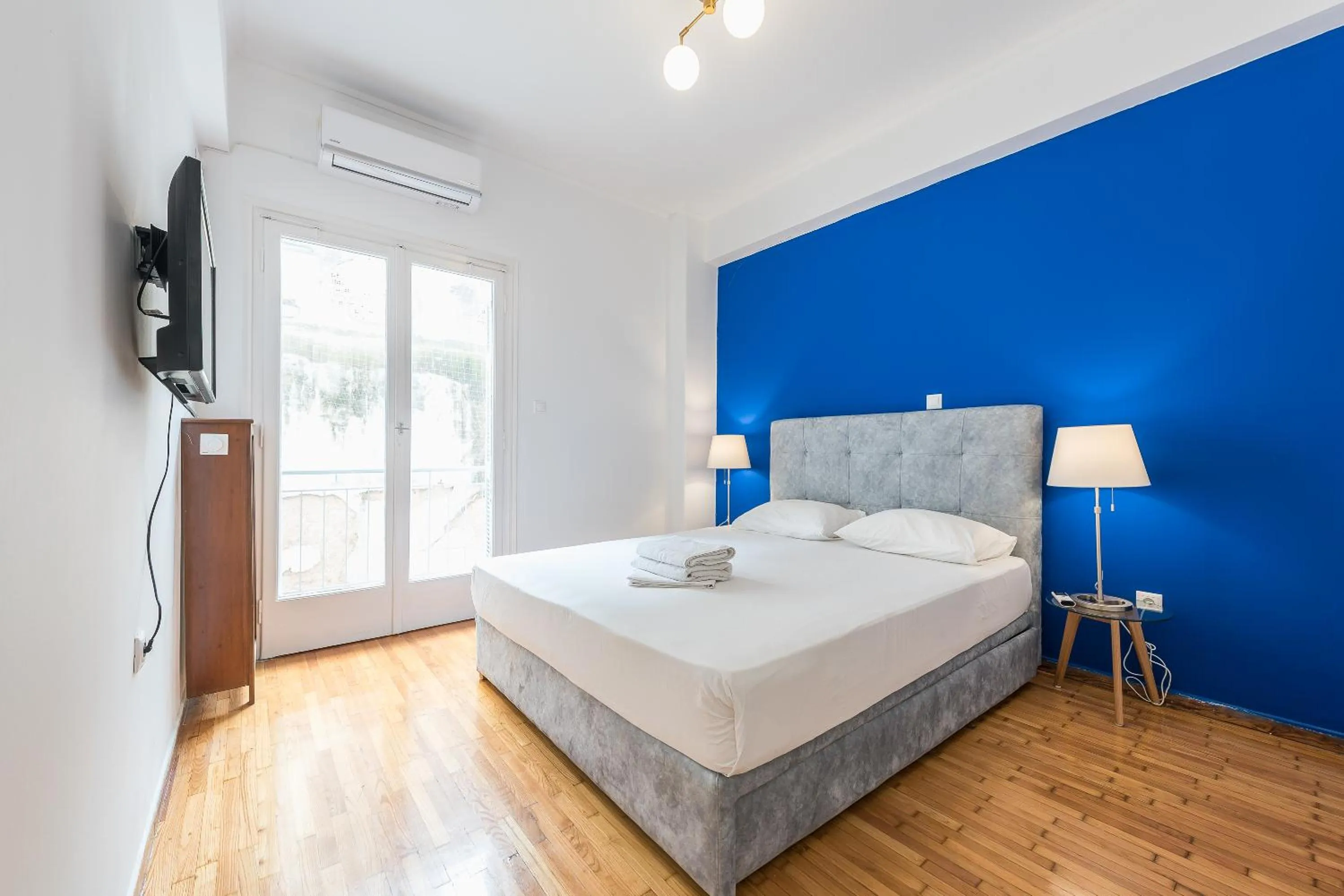 Bed in Victoria Queens Suites Apartments