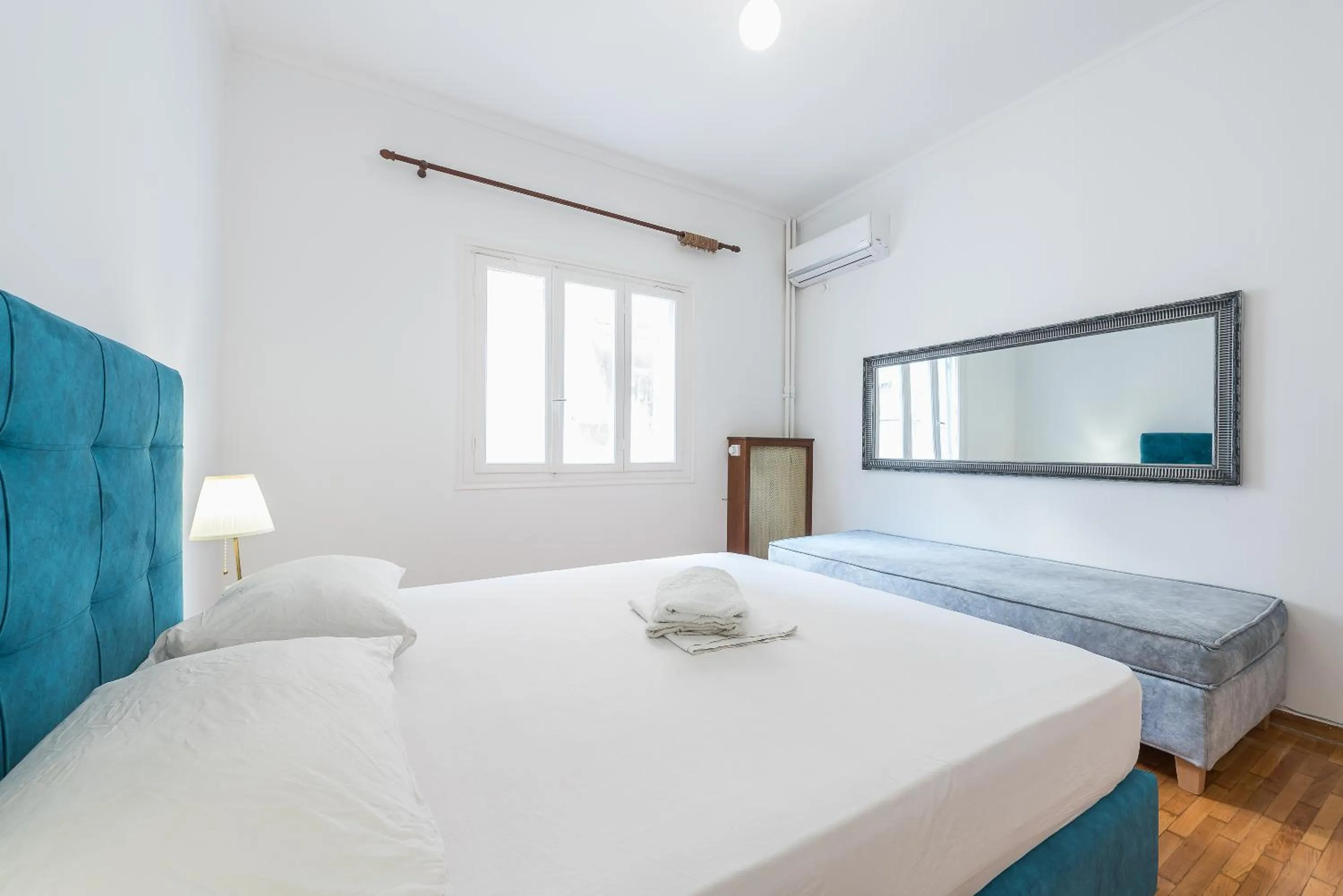 Bed in Victoria Queens Suites Apartments