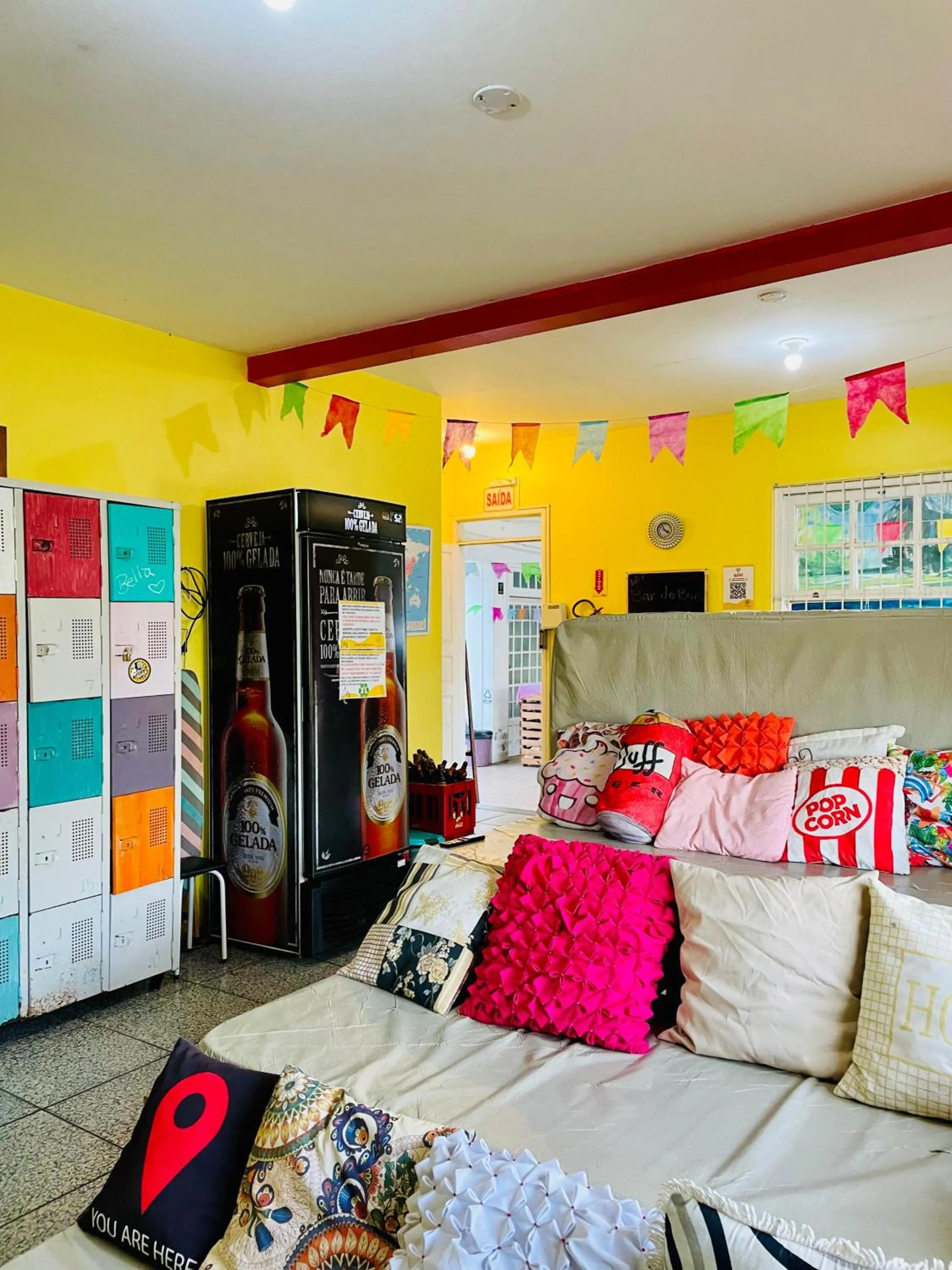 Communal lounge/ TV room in Pequi hostel